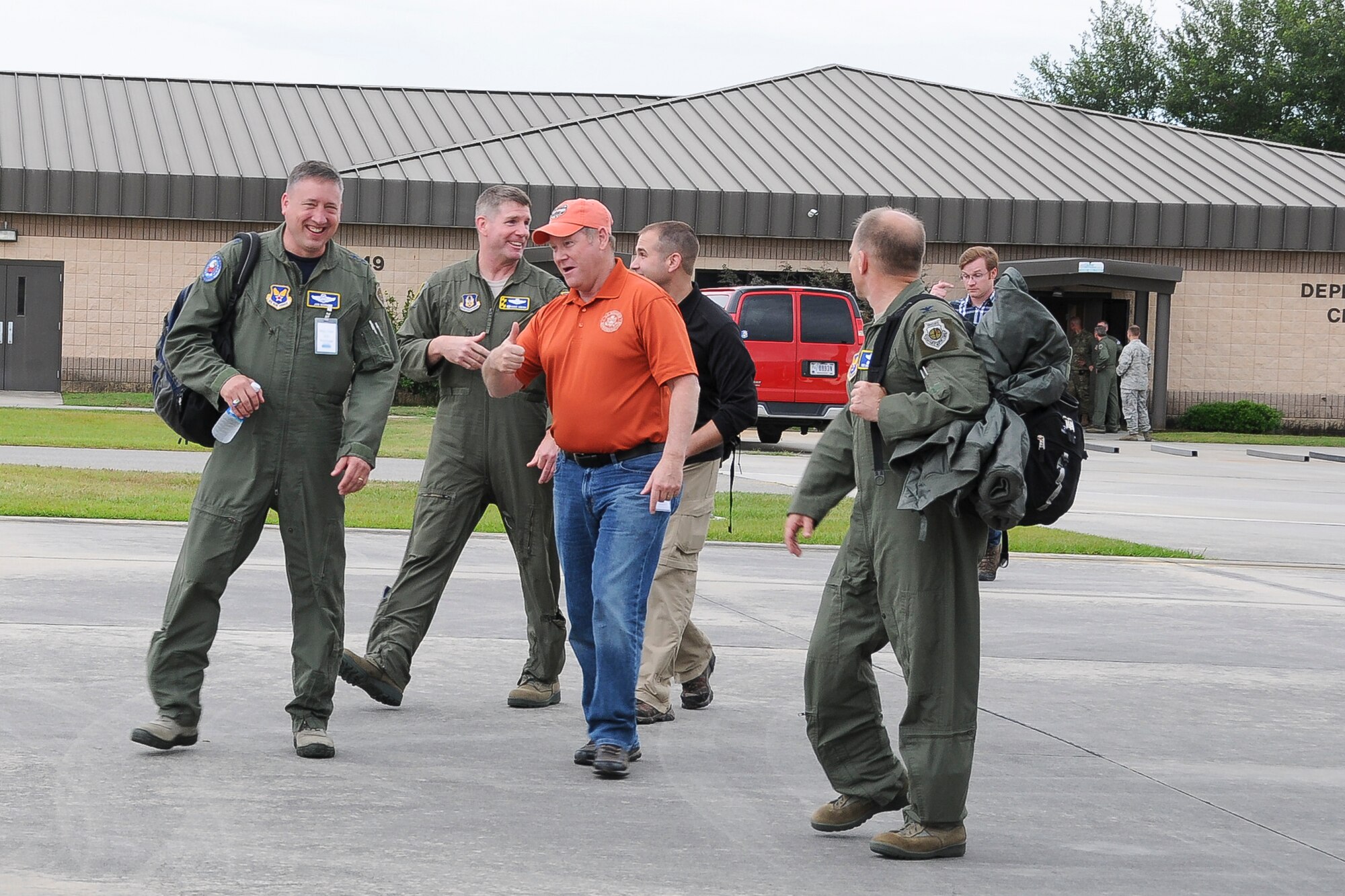Members of the 459th Air Refueling Wing and a congressional delegation make their way to a KC-135R Stratotanker on the Moody Air Force Base, Ga., flight line May 20. The 459th flew the delegation from Moody, where they witnessed an air power demonstration, back to the National Capital Region. On the return leg, the distinguished travelers were able to witness the in-flight refueling of a 1st Fighter Wing F-22 Raptor. (U.S. Air Force photo/Staff Sgt. Kat Justen)