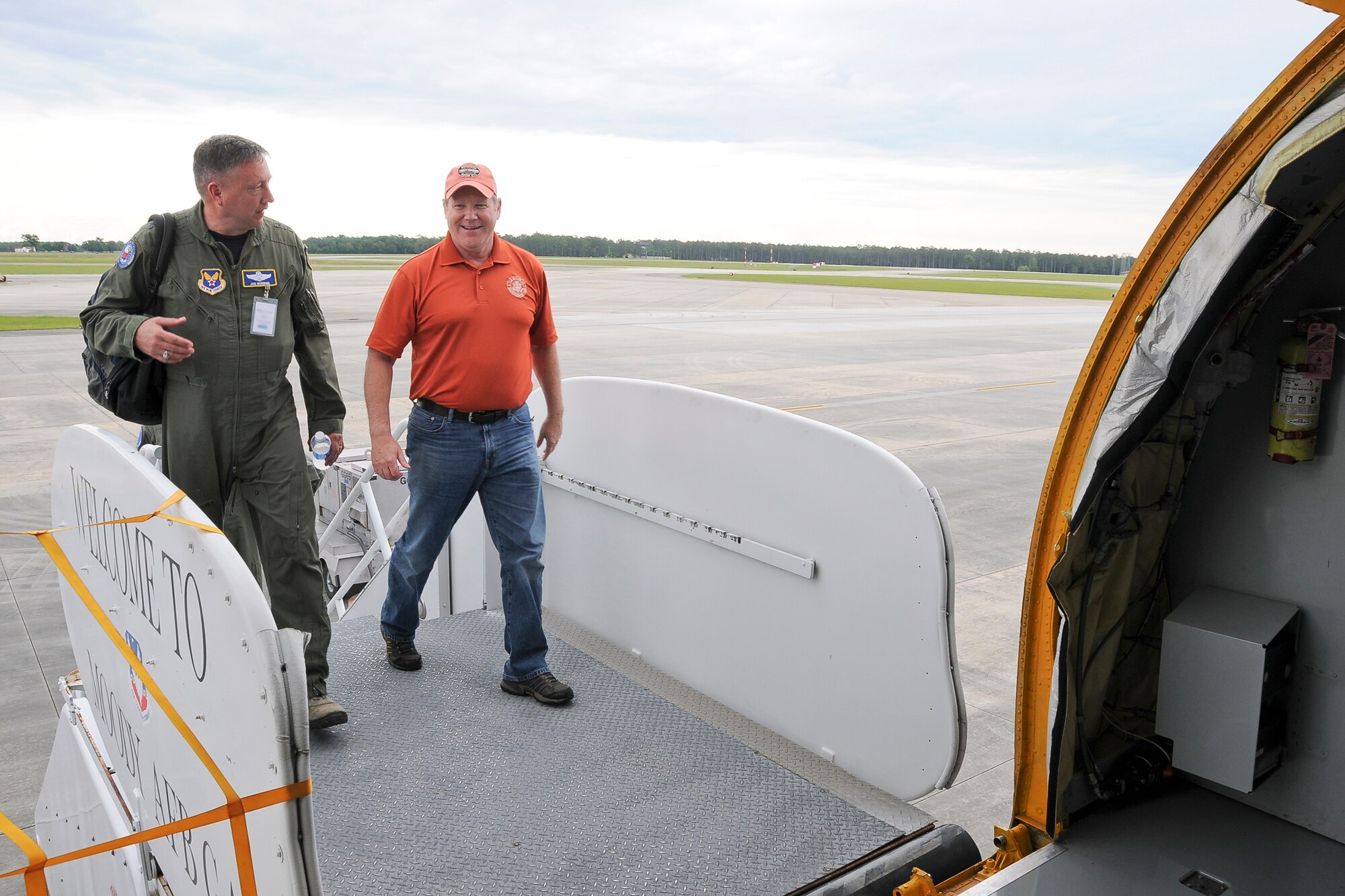 Major Gen. Jon Norman, Director of Global Power Programs in the Office of the Assistant Secretary of the Air Force for Acquisition, Headquarters U.S. Air Force, Washington, D.C. (left), and Rep. Reid Ribble (right) embark on a 459th Air Refueling Wing KC-135R Stratotanker on the Moody Air Force Base, Ga., flight line May 20. The 459th flew a congressional delegation from Moody, where they witnessed an air power demonstration, back to the National Capital Region. On the return leg, the distinguished travelers were able to witness the in-flight refueling of a 1st Fighter Wing F-22 Raptor. (U.S. Air Force photo/Staff Sgt. Kat Justen)