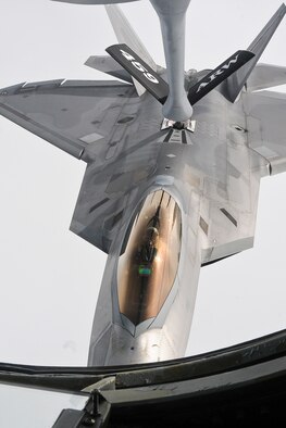 A 1st Fighter Wing F-22 Raptor is refueled by a 459th Air Refueling Wing KC-135R Stratotanker May 20. The 459th flew a congressional delegation from Moody Air Force Base, Ga., where they witnessed an air power demonstration, back to the National Capital Region. On the return leg, the distinguished travelers were able to witness the in-flight refueling. (U.S. Air Force photo/Staff Sgt. Kat Justen) 