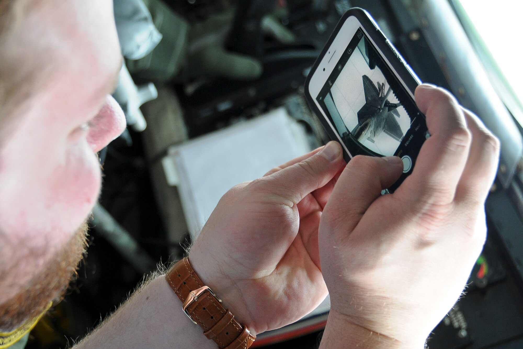 Congressional staffer Nick Schemmel takes a picture of a 1st Fighter Wing F-22 Raptor inside the boom pod of a 459th Air Refueling Wing KC-135R Stratotanker May 20. The 459th flew a congressional delegation from Moody Air Force Base, Ga., where they witnessed an air power demonstration, back to the National Capital Region. On the return leg, the distinguished travelers were able to witness the in-flight refueling. (U.S. Air Force photo/Staff Sgt. Kat Justen)