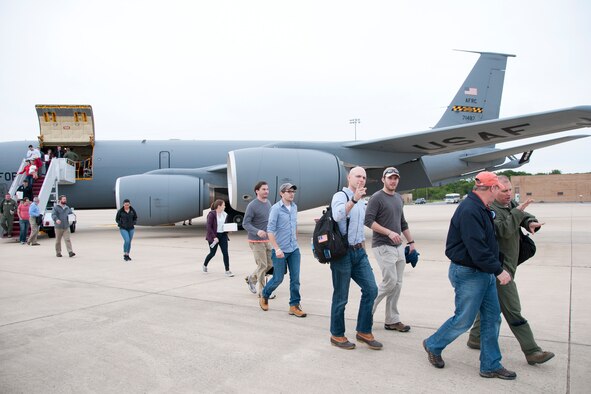 Members of a congressional delegation disembark a 459th Air Refueling Wing KC-135R Stratotanker onto the Joint Base Andrews flight line May 20. The 459th flew the delegation from Moody Air Force Base, Ga., where they witnessed an air power demonstration, back to the National Capital Region. On the return leg, the distinguished travelers were able to witness the in-flight refueling of a 1st Fighter Wing F-22 Raptor. (U.S. Air Force photo/Staff Sgt. Kat Justen)