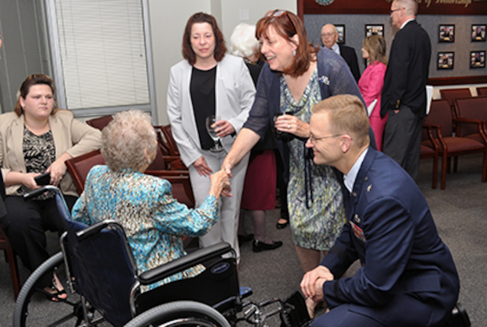 DLA Energy Commander Air Force Brig. Gen. Mark McLeod and his wife, Laura McLeod, greet Mrs. Faye Moon, the widow of Energy Hall of Fame inductee Bill Moon, in the Kunkel Conference Room prior to the DLA Energy inaugural Hall of Fame, May 19. 