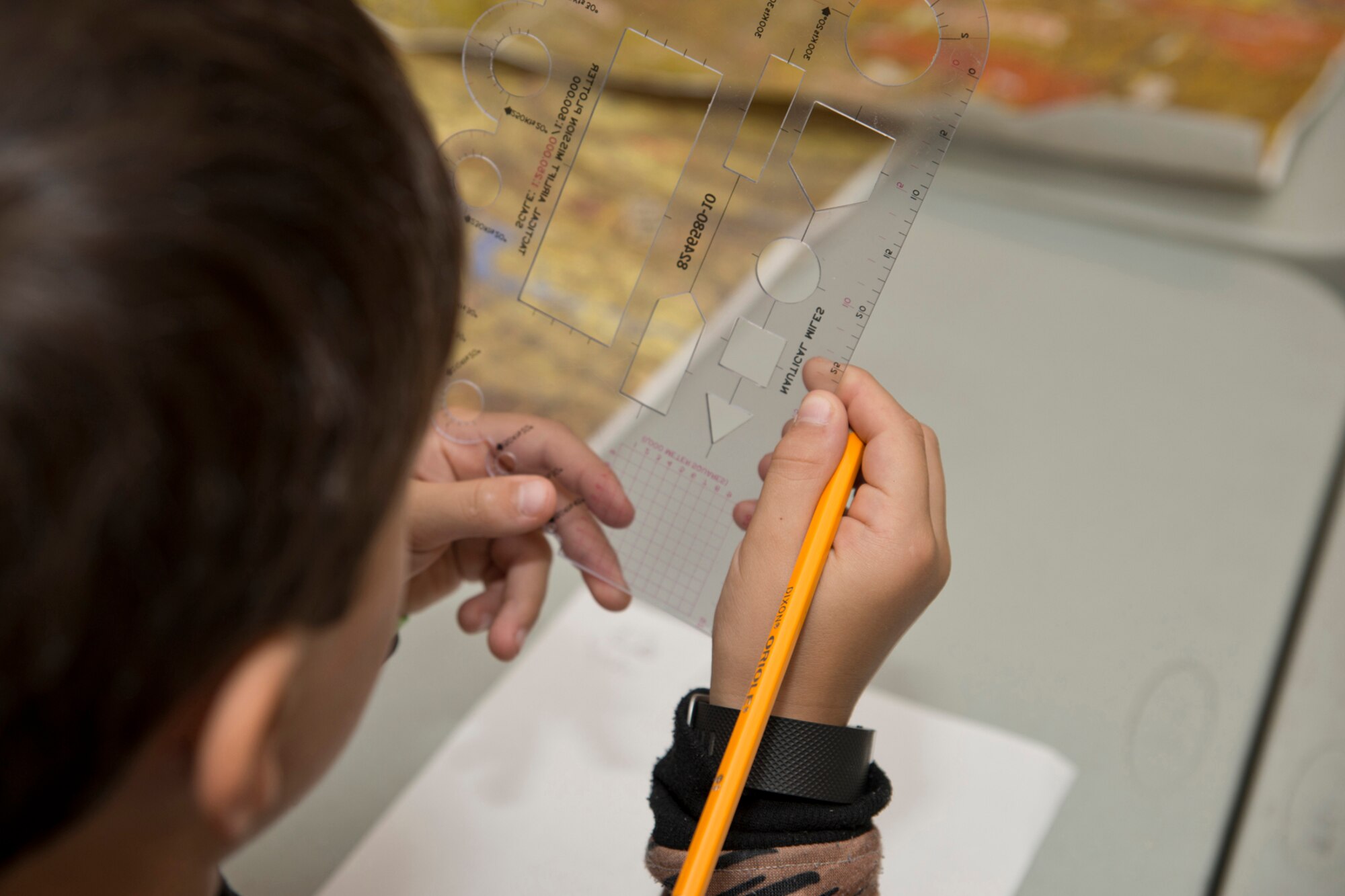 A student from Julia Lee Moore Elementary School examines a tactical airlift mission plotter during the Fourth Grade Elementary Career Fair held at the Second Baptist Church in Conway Ark., May 17, 2016. More than 250 students from Conway Public Schools took part in the fair, where nine volunteers presented information about careers in aviation, modeling, nursing, coaching, banking, real estate, law enforcement, music and military service. (U.S. Air Force photo by Master Sgt. Jeff Walston/Released)  