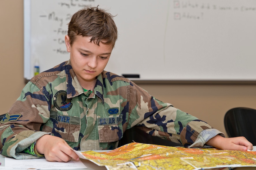 Rylan Webb, a student from Julia Lee Moore Elementary School, examines an aviation map during the Fourth Grade Elementary Career Fair held at the Second Baptist Church in Conway Ark., May 17, 2016. More than 250 students from Conway Public Schools took part in the fair, where nine volunteers presented information about careers in aviation, modeling, nursing, coaching, banking, real estate, law enforcement, music and military service. (U.S. Air Force photo by Master Sgt. Jeff Walston/Released)  