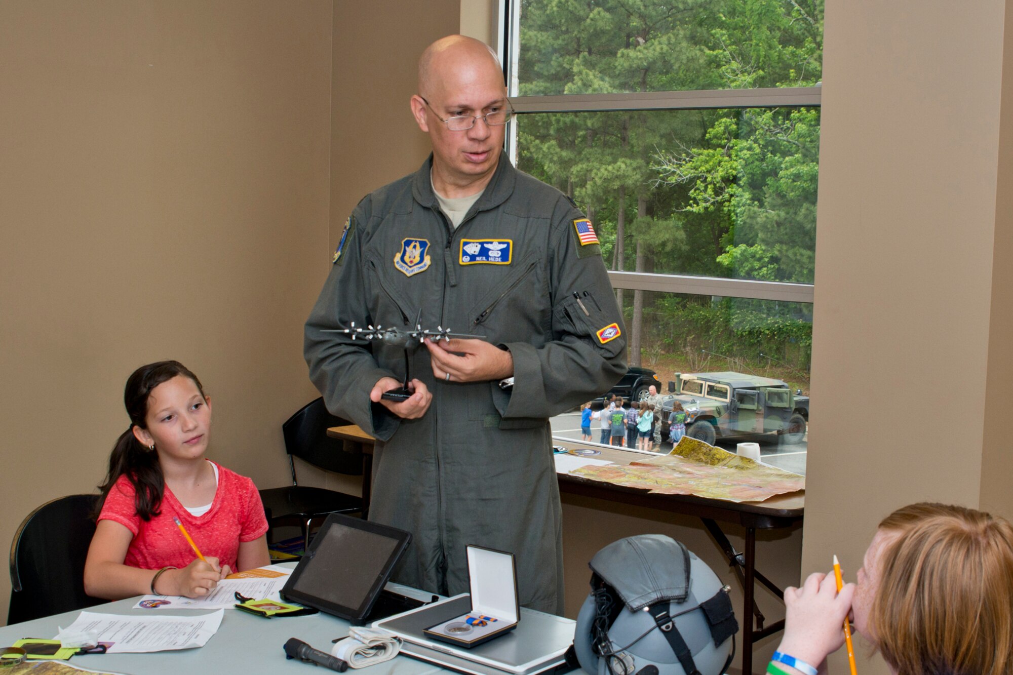 U.S. Air Force Reservist Lt. Col. Neil Hede, commander, 327th Airlift Squadron, tells students from Julia Lee Moore Elementary School about the different aviation careers during the Fourth Grade Elementary Career Fair held at the Second Baptist Church in Conway Ark., May 17, 2016. Hede volunteered to introduce the more than 250 students from Conway Public Schools to what he does as an Air Force Reserve Pilot and show them that one can be highly successful in whatever they choose to do through perseverance and hard work.(U.S. Air Force photo by Master Sgt. Jeff Walston/Released)  