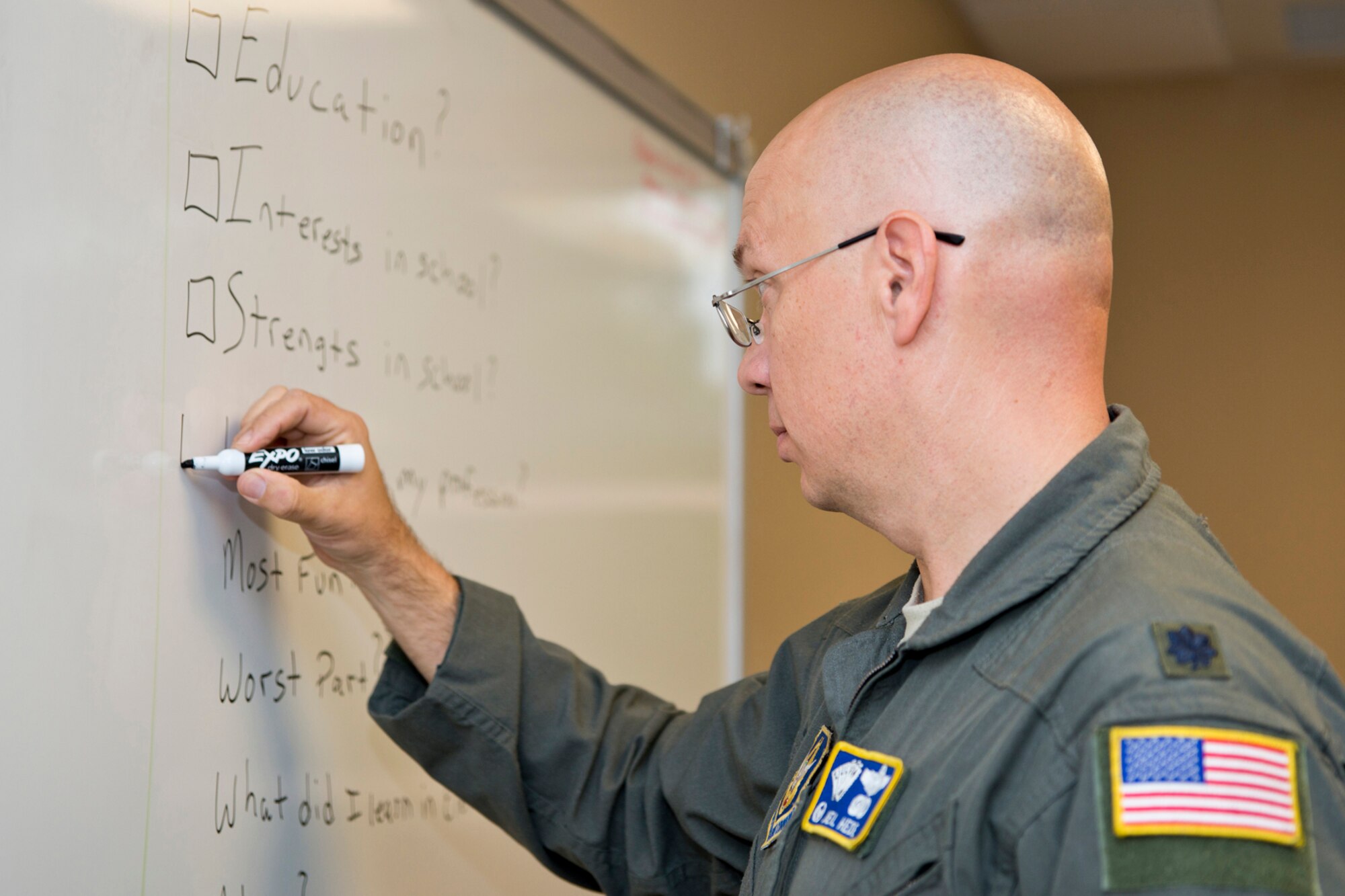 U.S. Air Force Reserve Lt. Col. Neil Hede, commander, 327th Airlift Squadron, prepares his classroom for the more than 250 students expected to attend the Fourth Grade Elementary Career Fair held at the Second Baptist Church in Conway Ark., May 17, 2016. Hede volunteered to introduce the more than 250 students from Conway Public Schools to what he does as an Air Force Reserve Pilot and show them that one can be highly successful in whatever they choose to do through perseverance and hard work. (U.S. Air Force photo by Master Sgt. Jeff Walston/Released)  