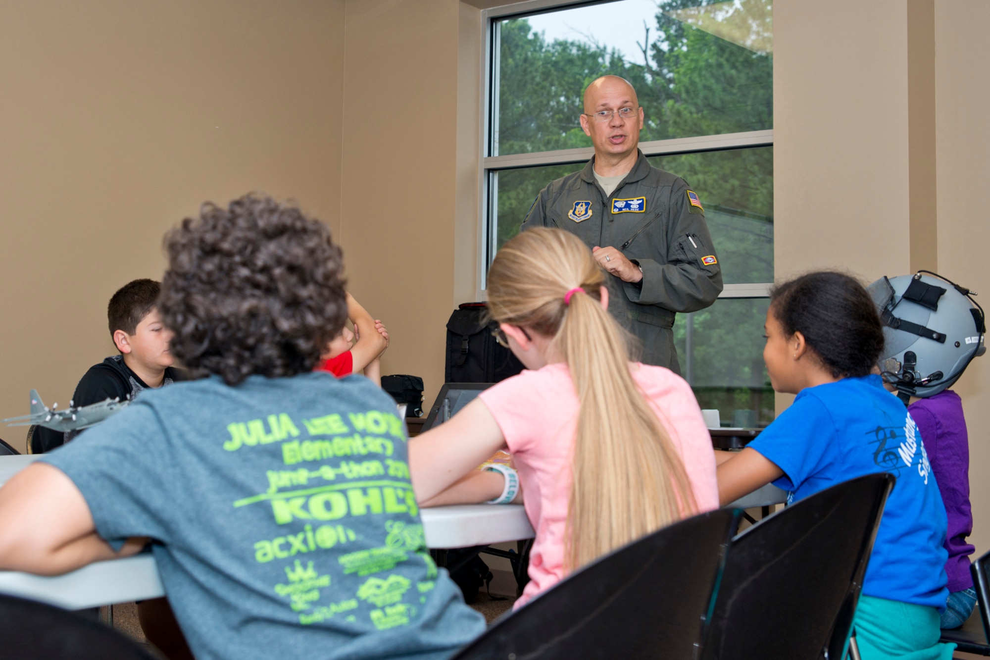U.S. Air Force Reserve Lt. Col. Neil Hede, commander, 327th Airlift Squadron, enlightens Julia Lee Moore Elementary School students about the different careers in aviation during the Fourth Grade Elementary Career Fair held at the Second Baptist Church in Conway Ark., May 17, 2016. Hede volunteered to introduce the more than 250 students from Conway Public Schools to what he does as an Air Force Reserve Pilot and show them that one can be highly successful in whatever they choose to do through perseverance and hard work.(U.S. Air Force photo by Master Sgt. Jeff Walston/Released)  