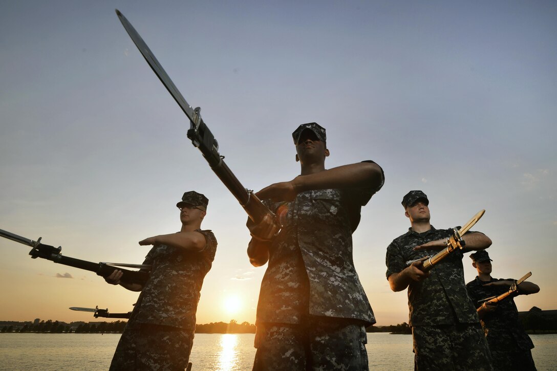 Members of the Navy Ceremonial Guard Drill Team train outside the guard's facility at Joint Base Anacostia-Bolling in Washington, D.C., May 19, 2016. Air National Guard photo by Staff Sgt. Christopher S. Muncy