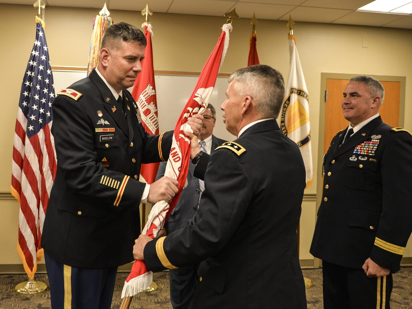 Col. Benjamin J. Bigelow accepts the flag from Lt. Gen. Todd T. Semonite, Chief of Engineers, to  assume command of the U.S. Army Corps of Engineers’ Great Lakes and Ohio River Division from outgoing commander Brig. Gen. Richard G. Kaiser during a ceremony here in Cincinnati, OH on May 24, 2016.
