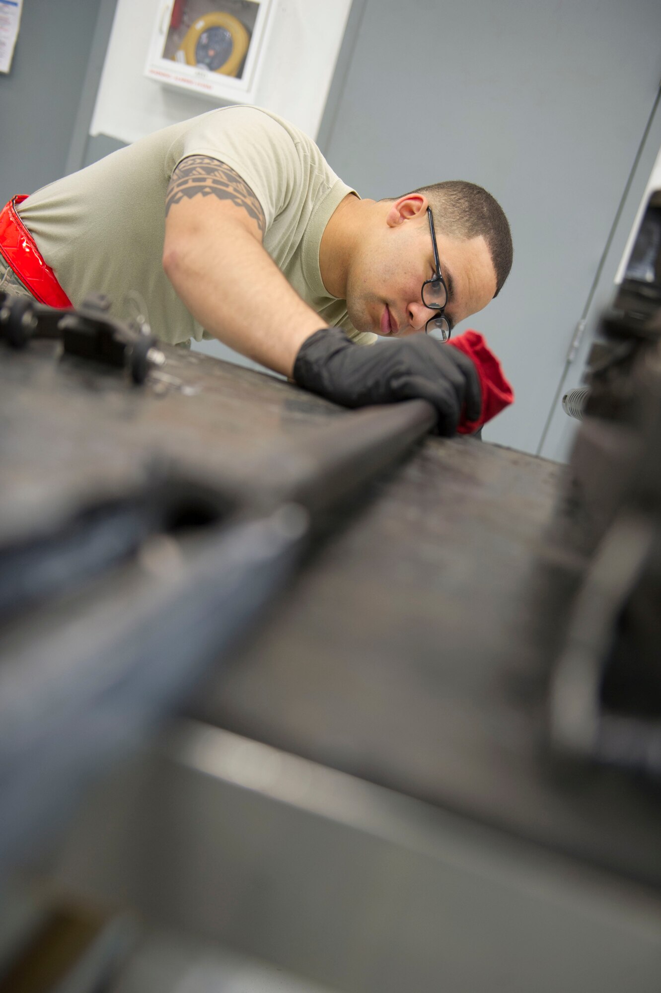 Airman 1st Class Jamir Sinex, a weapons load crew journeyman with the 801st Special Operations Aircraft Maintenance Squadron, checks the barrel of a 50-caliber machine gun during a 28-day inspection at Hurlburt Field, Fla., May 17, 2016. The inspections are performed as preventive maintenance. (U.S. Air Force photo by Senior Airman Krystal M. Garrett)