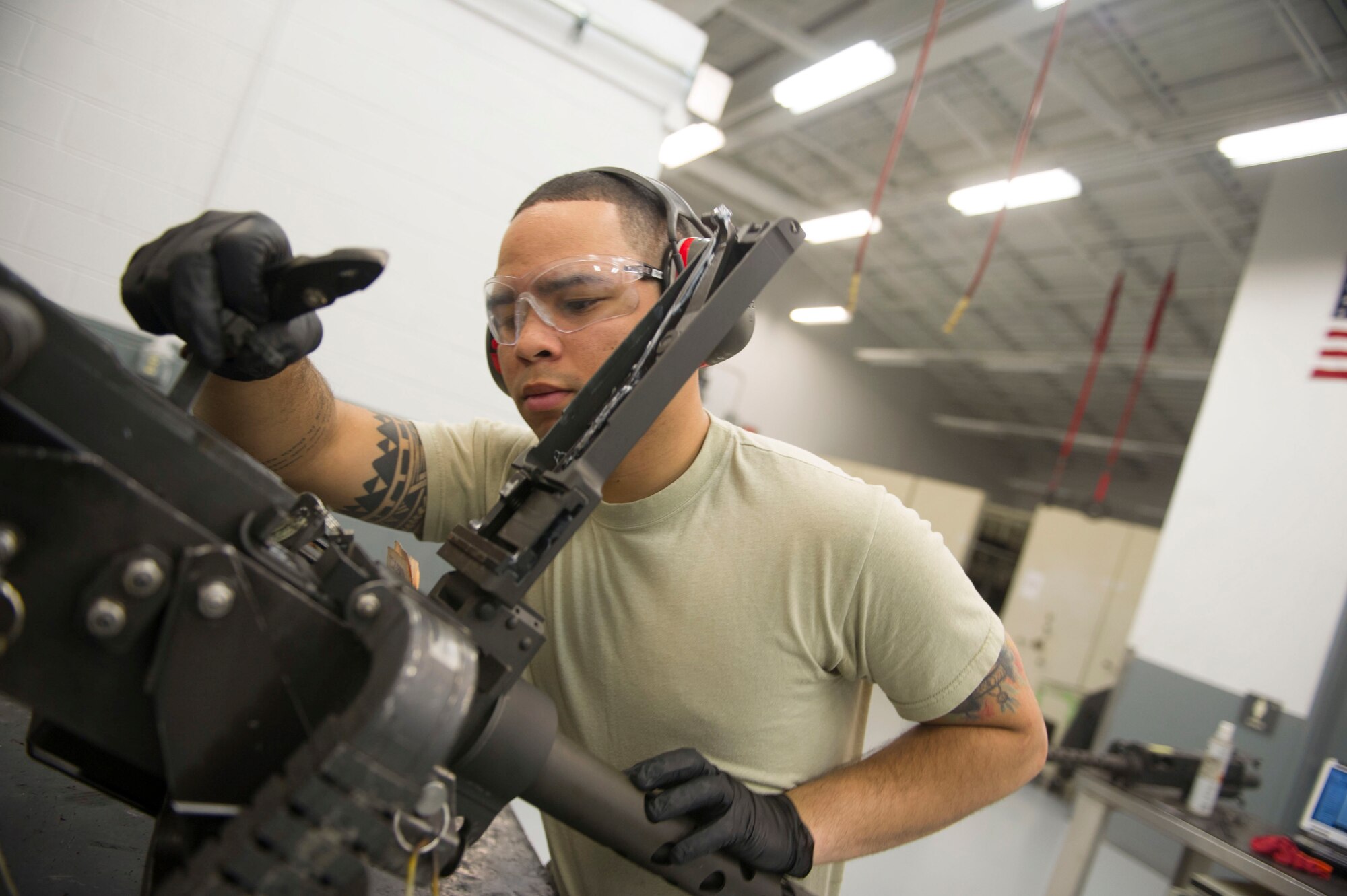 Airman 1st Class Jamir Sinex, a weapons load crew journeyman with the 801st Special Operations Aircraft Maintenance Squadron, performs a function check on a 50-caliber gun during a 28-day inspection at Hurlburt Field, Fla., May 17, 2016. Every 28 days the weapons systems are taken apart, checked, lubricated and put back together. (U.S. Air Force photo by Senior Airman Krystal M. Garrett) 