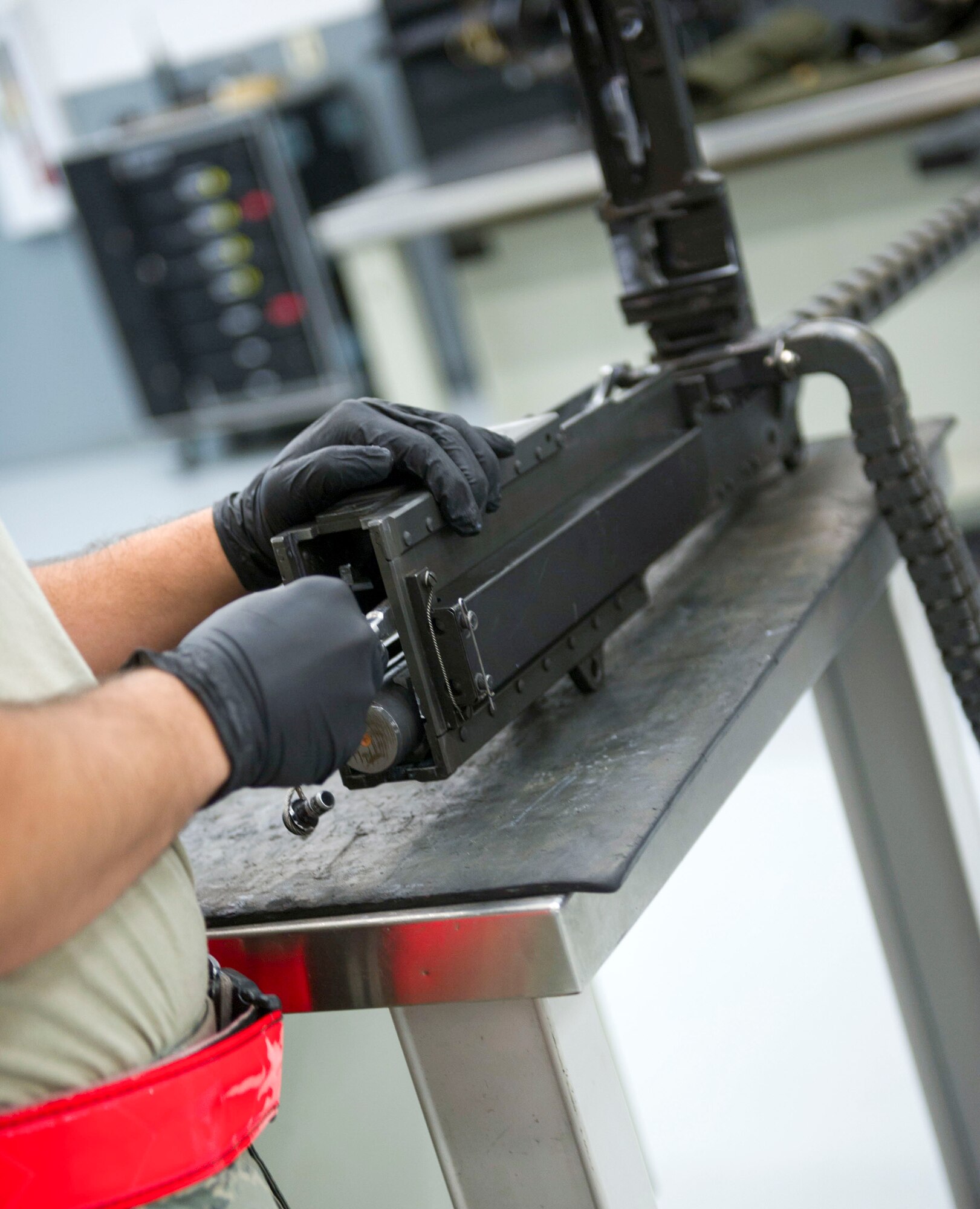 Airman 1st Class Jamir Sinex, a weapons load crew journeyman with the 801st Special Operations Aircraft Maintenance Squadron, puts a 50-caliber gun together after performing a 28-day inspection at Hurlburt Field, Fla., May 17, 2016. Every 28 days the weapons systems are taken apart, checked, lubricated and put back together. (U.S. Air Force photo by Senior Airman Krystal M. Garrett) 