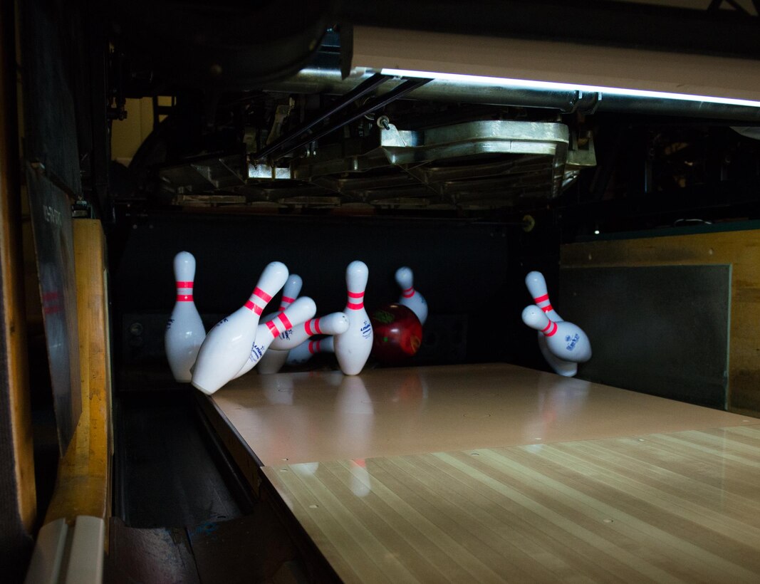 Bowling pins get knocked down during the Armed Forces Bowling Championships at Travis Air Force Base, California (U.S. Air Foce Photo by Louis Briscese)