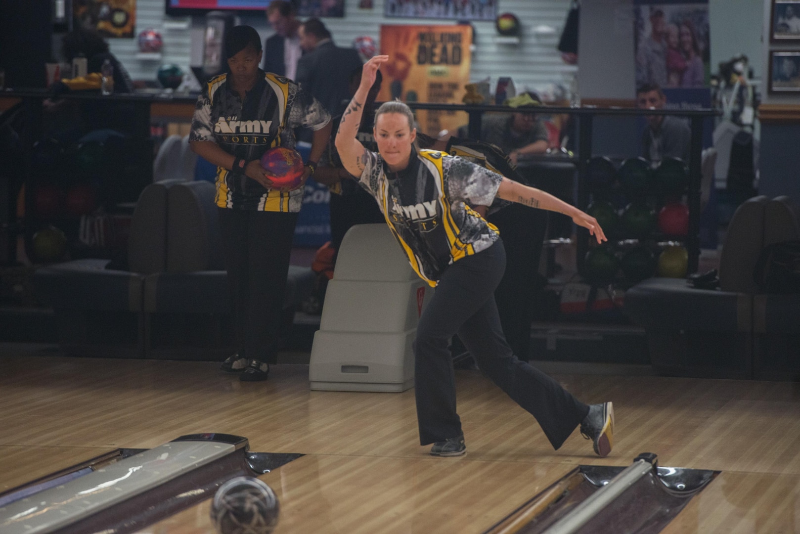 U.S Army Staff Sergeant Rose Brown, a military police officer assigned to Fort Bliss, Texas, warms up before competing in the Armed Forces Bowling Championship, Travis Air Force Base, Calif. The week long event showcases the Services best bowlers who compete for best male, female and team bowlers, May 11, 2016. (U.S. Air Force Photo by Louis Briscese/Released)