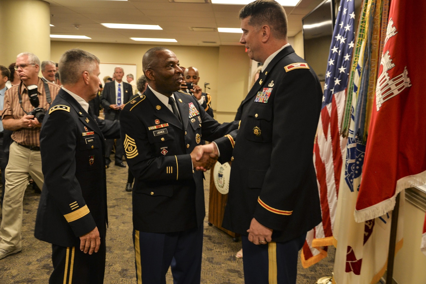 USACE Command Sergeant Major, Antonio S. Jones, congratulates incoming LRD Commander, Colonel Benjamin J. Bigelow, following a ceremony in Cincinnati on May 24, 2016.