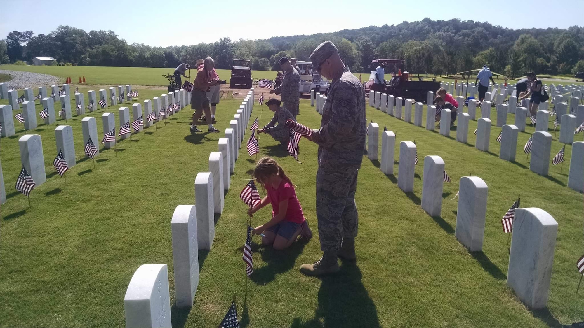 Members from Air Force Sergeants Association Chapter 444 and others from the area place flags at the Alabama National Cemetery in Montevallo, Alabama, Memorial Day 2015.  The AFSA is inviting local community members to participate in a commemoration this Memorial Day weekend with a flag placing and visit to the Bill Nichols Veterans Administration Home in Alexander City, Alabama.