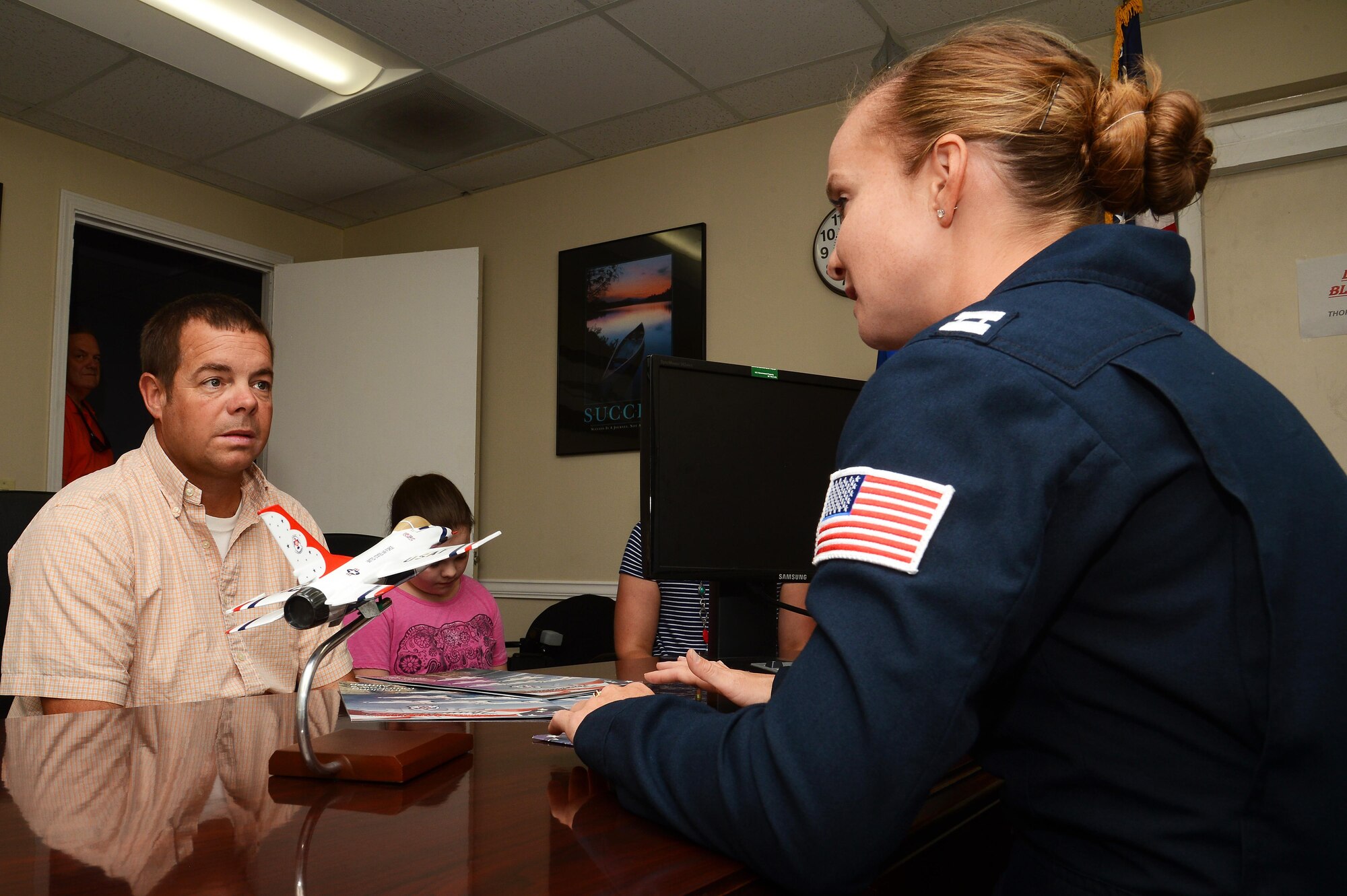 U.S. Air Force Capt. Sara Harper, U.S. Air Force Air Demonstration Squadron public affairs officer, details the mission of the Thunderbirds to Christopher Geddings, Sumter City fire department engineer, before his hometown hero flight at Shaw Air Force Base, S.C., May 17, 2016. The hometown hero flight awards a local civilian with the opportunity to fly in an F-16 Fighting Falcon with a Thunderbird pilot as recognition for their dedicated efforts within their community. (U.S. Air Force photo by Senior Airman Jonathan Bass)
