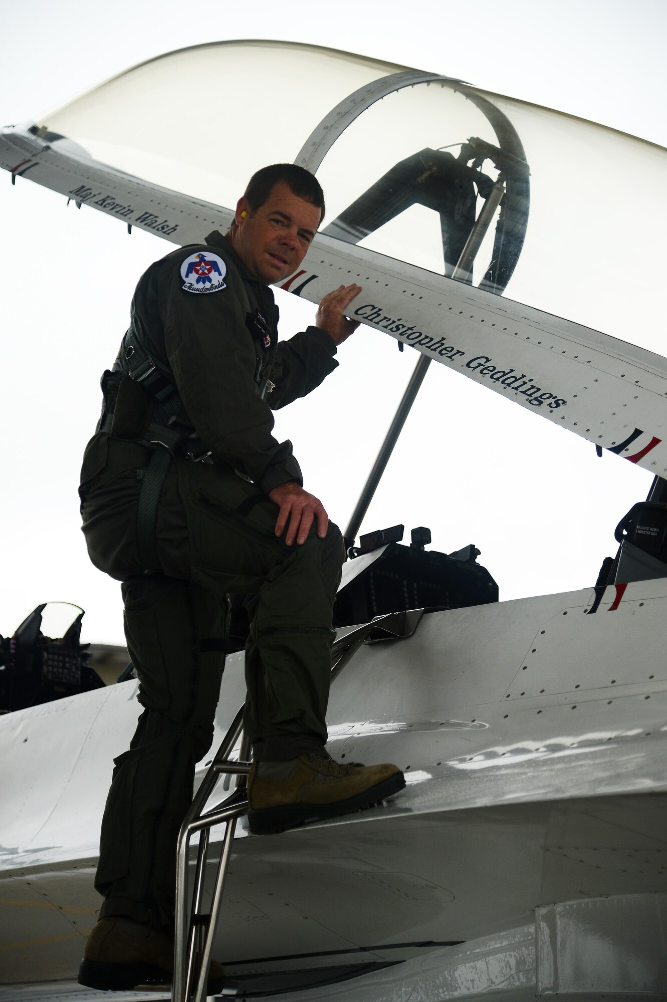 Christopher Geddings, Sumter City fire department engineer, poses with the F-16 Fighting Falcon he flew in during his hometown hero flight at Shaw Air Force Base, S.C., May 20, 2016. Geddings received the honor after being nominated by his supervision as part of the Shaw Air Expo and open house. (U.S. Air Force photo by Senior Airman Jonathan Bass)