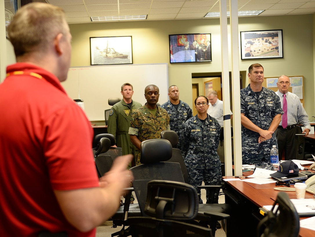 Steve Dancer, emergency manager, Marine Corps Logistics Base Albany, briefs Col. James C. Carroll III, commanding officer, MCLB Albany, during Hurricane Exercise 16 aboard the installation, May 17.
The exercise scenario was focused on a category 3 hurricane making a simulated landfall on the Florida Pan Handle and moving into and across Georgia toward the East Coast.  
MCLB Albany officials focused on the impact the hurricane may have on units that have memorandum of agreements with the installation, according to Dancer. 
“These units may have to evacuate from their home station and use Marine Corps Logistics Base Albany as their ‘safe haven’,” Dancer said. “This is the first time that all of the units from the Pensacola, Florida, area were actually able to come together and conduct their site survey, memorandum of agreements review and participate in a table top exercise.”  
Dancer added the exercise was a success and will pave the way for future "safe haven" operations.
