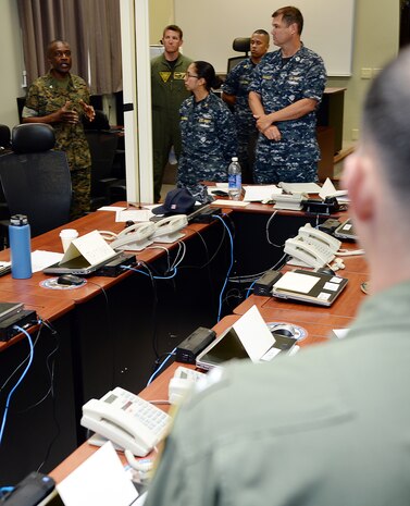 Col. James C. Carroll III, commanding officer, Marine Corps Logistics Base Albany, greets unit representatives/role players during Hurricane Exercise 16 aboard Marine Corps Logistics Base Albany, May 17.
The exercise scenario was focused on a category 3 hurricane making a simulated landfall on the Florida Pan Handle and moving into and across Georgia toward the East Coast.  
MCLB Albany officials focused on the impact the hurricane may have on units that have memorandum of agreements with the installation, according to Steve Dancer, emergency manager, MCLB Albany. 
“These units may have to evacuate from their home station and use Marine Corps Logistics Base Albany as their ‘safe haven’,” Dancer said. “This is the first time that all of the units from the Pensacola, Florida, area were actually able to come together and conduct their site survey, memorandum of agreements review and participate in a table top exercise.”  
Dancer added the exercise was a success and will pave the way for future "safe haven" operations.
