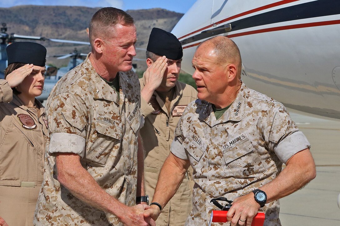 CAMP PENDLETON, Calif. -- General Robert Neller, Commandant, United States Marine Corps, shakes hands with Brig. Gen. Edward Banta, Commanding General, Marine Corps Installations - West, during a tour of Marine Corps Air Station Camp Pendleton, May 24.