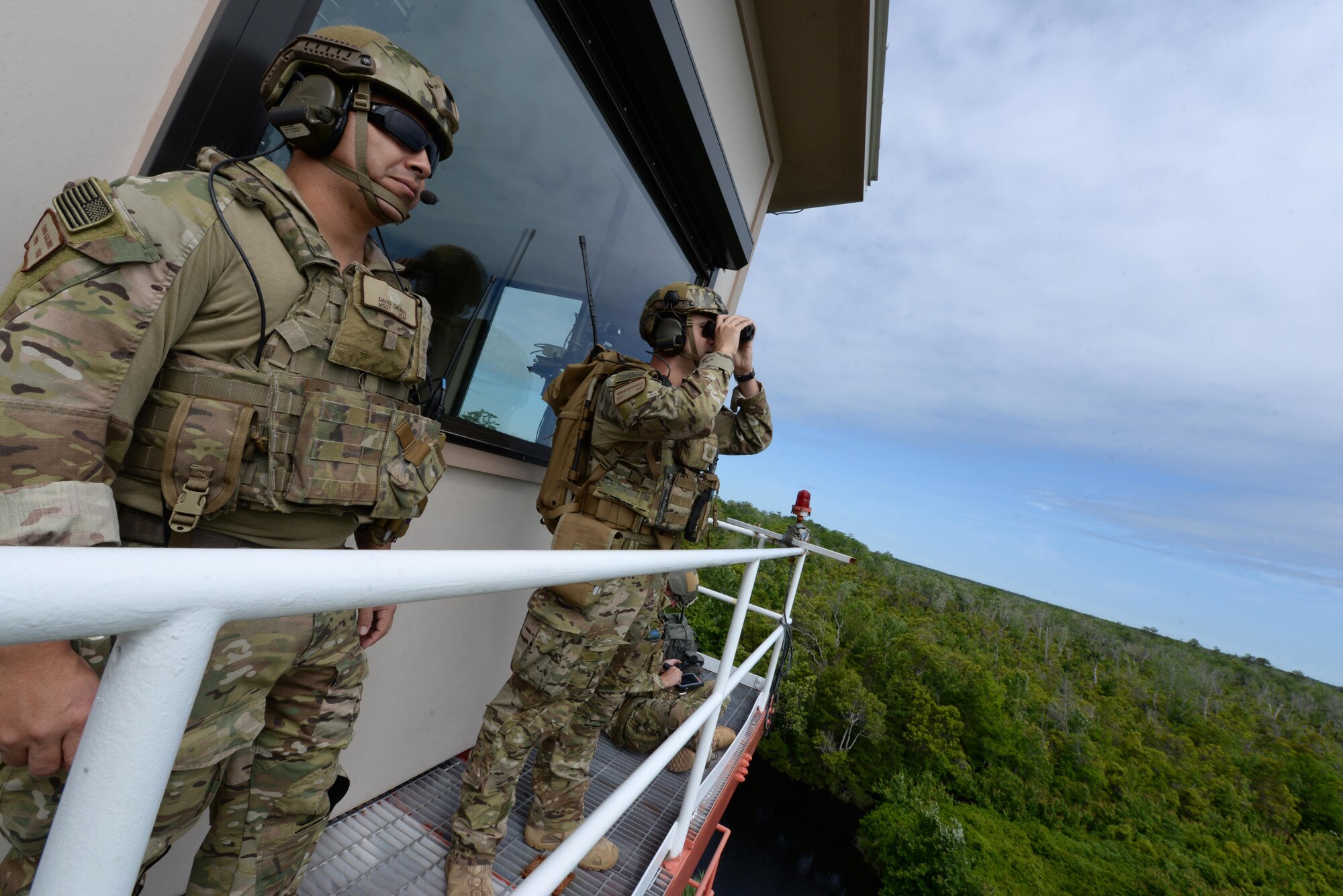 Master Sgt. David Galindo (left), 25th Air Support Operations Squadron Flight Chief, Staff Sgt. Andrew MacDonald (center), 25th ASOS joint terminal attack controllers and Staff Sgt. Andrew Hardie (right), 25th ASOS combat command battle management operator, watch for simulated strikes against military aircraft during exercise Razor Talon, May 20, 2016, at Dare County Bombing Range, North Carolina. This Razor Talon included a ground scenario with live opposing forces and moving targets for the first time. (U.S. Air Force photo by Airman 1st Class Ashley Williamson/Released)