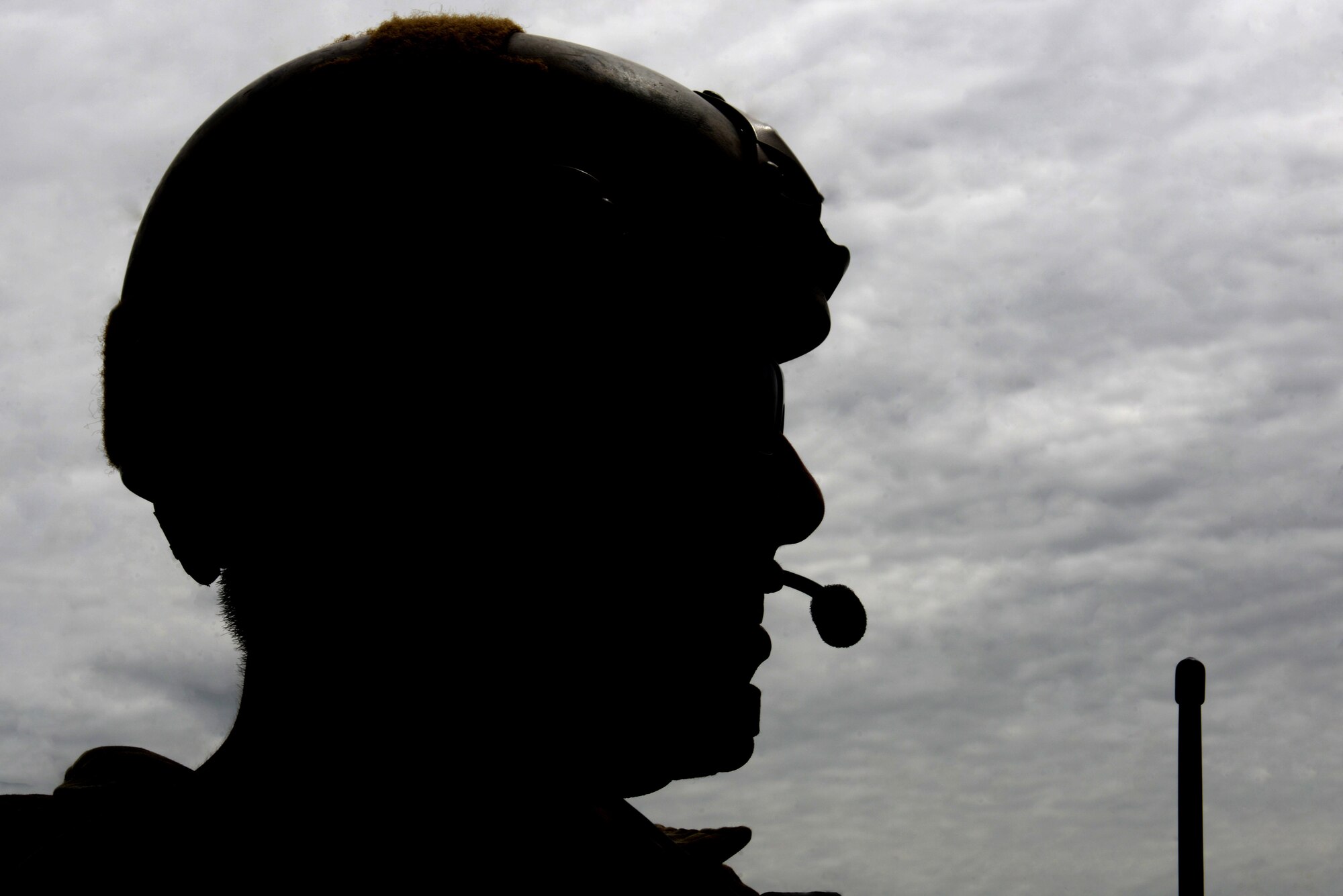 Master Sgt. David Galindo, 25th Air Support Operations Squadron flight chief, listens to commands over radio frequencies during exercise Razor Talon, May 20, 2016, at Dare County Bombing Range, North Carolina. Exercise organizers planned for months to include the joint close air support ground team into Razor Talon. (U.S. Air Force photo by Airman 1st Class Ashley Williamson/Released)