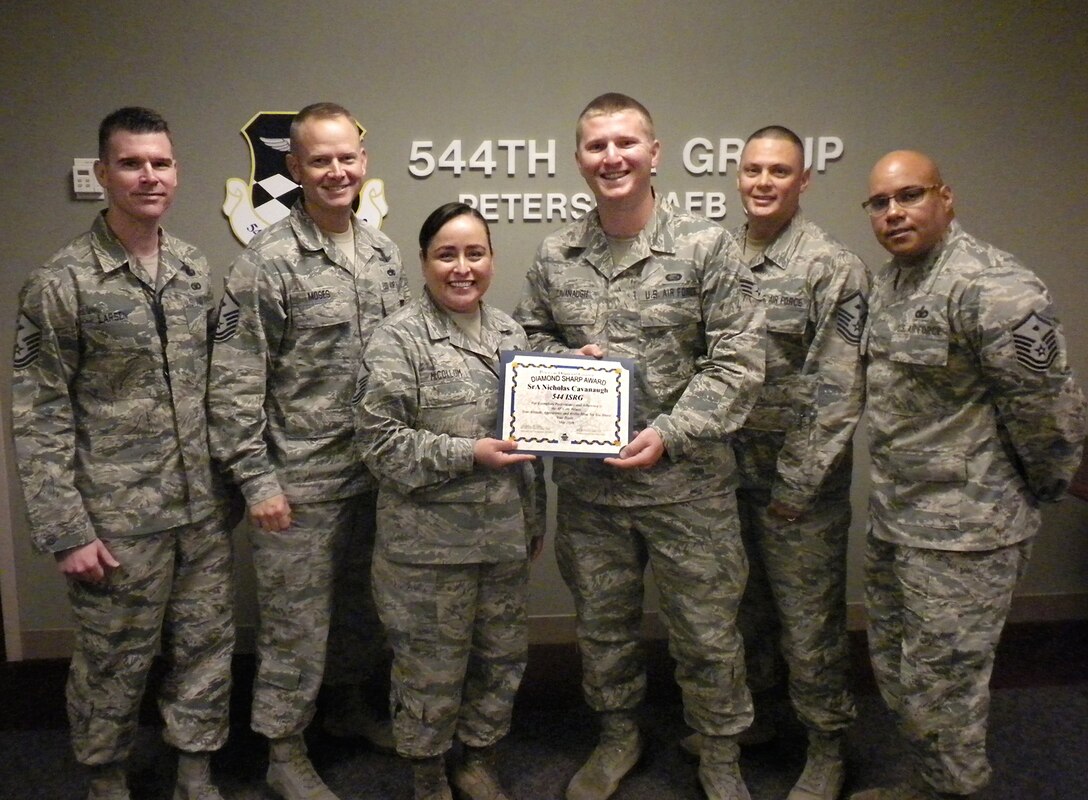 Senior Airman Nicholas Cavanaugh, 544th Intelligence, Surveillance and Reconnaissance Group command support staff, receives the Diamond Sharp Award from the 21st Space Wing First Sergeant Council at Peterson Air Force Base, Colo. on May 18, 2016. Cavanaugh was responsible for roll out of the new Air Force evaluation system at the 544th ISRG for more than 527 personnel. Additionally, he is the founder of a non-profit organization advocating for sex trafficking victims in Colorado and transformed the lives of 20 women by raising $120,000 to assist in rehabilitation. (U.S. Air Force photo)