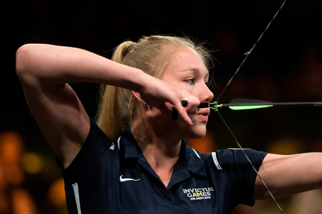 Army Spc. Chasity Kuczer takes aim during the final round of the individual open compound bow competition at the 2016 Invictus Games in Orlando, Fla., May 9, 2016. Kuczer won the silver medal. DoD photo by EJ Hersom
