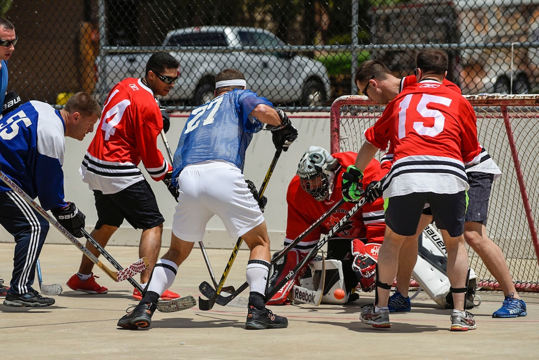 The goalie for Team Canada defends the net during the 3rd Annual Canada versus U.S.A. Ball Hockey Game at the Peterson Air Force Base, Colo., Roller Hockey Rink on May 20, 2016. The game brought together mission partners to encourage camaraderie and sportsmanship. (U.S. Air Force photo by Senior Airman Rose Gudex)