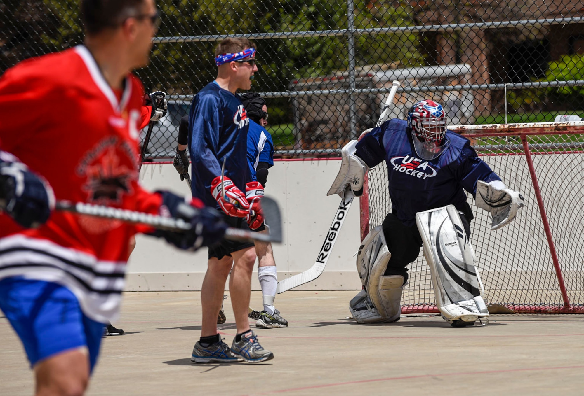 Lt. Col. Miguel Rosales, Colorado Springs Regional Command Post chief, defends the goal during the 3rd Annual Canada versus U.S.A. Ball Hockey Game at the Peterson Air Force Base, Colo., Roller Hockey Rink on May 20, 2016. Canada took home the trophy for the third year running beating the Americans 4-3. (U.S. Air Force photo by Senior Airman Rose Gudex)