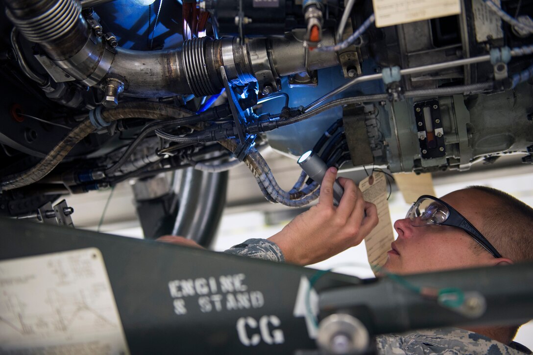 U.S. Air Force Tech. Sgt. Matthew Cohen, 23d Maintenance Group quality assurance inspector, scans the components of a TF-34 jet engine during an inspection, May 24, 2016, at Moody Air Force Base, Ga. QA inspectors ensure that aviation assets conform to established requirements throughout their life cycle for maximum serviceability. (U.S. Air Force photo by Airman 1st Class Greg Nash/Released)  