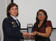 Col. Andrea Tullos, 42nd Air Base Wing commander, receives the Noel F. Parrish Memorial Trophy during the second annual Legends of Aviation Award Ceremony, May 20, 2016, Tuskegee, Ala. The honor is awarded to distinguished individuals who demonstrate a high standard of leadership. (U.S. Air Force photo/ Airman 1st Class Alexa Culbert)