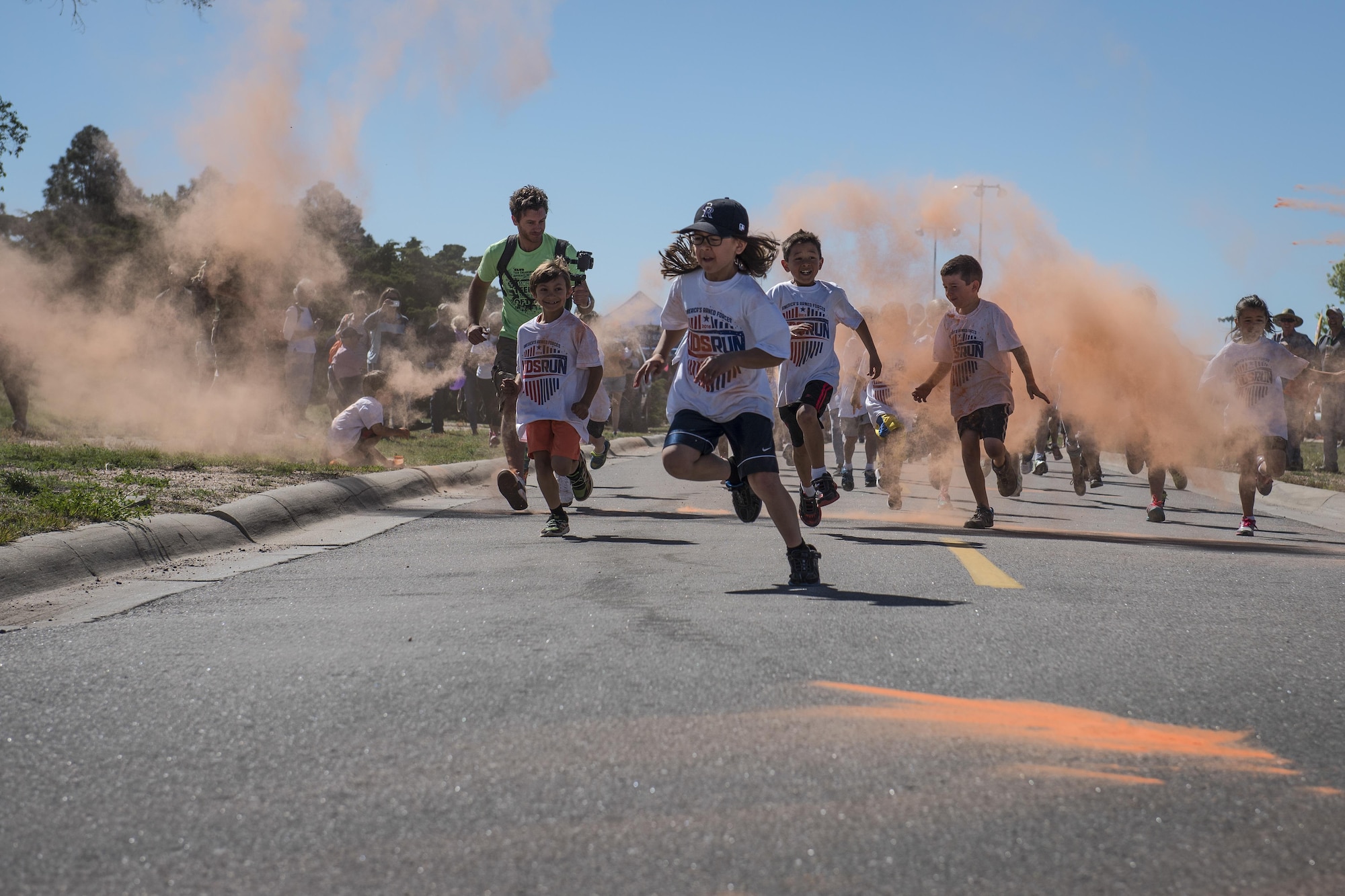 Peterson youth get blasted with paint during the America’s Kids Color Run which started the Kickoff to Summer event at Peterson’s Outdoor Recreation on May 23, 2016. The event also included bounce castles, inflatable games, a kid’s bike rodeo, food and prizes. (U.S. Air Force photo by Senior Airman Rose Gudex)
