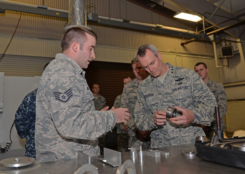 Staff Sgt. Isaac King, 33rd Maintenance Squadron aircraft metals technician, shows Lt. Gen. Darryl Roberson, Air Education Training Command commander, a horizontal stabilizer during a tour at Eglin Air Force Base, Florida, Feb. 18, 2016. 33rd Fighter Wing innovations like this one are being used by F-35A Lightning II bases across the United States. (U.S. Air Force Photo/ Senior Airman Andrea Posey)