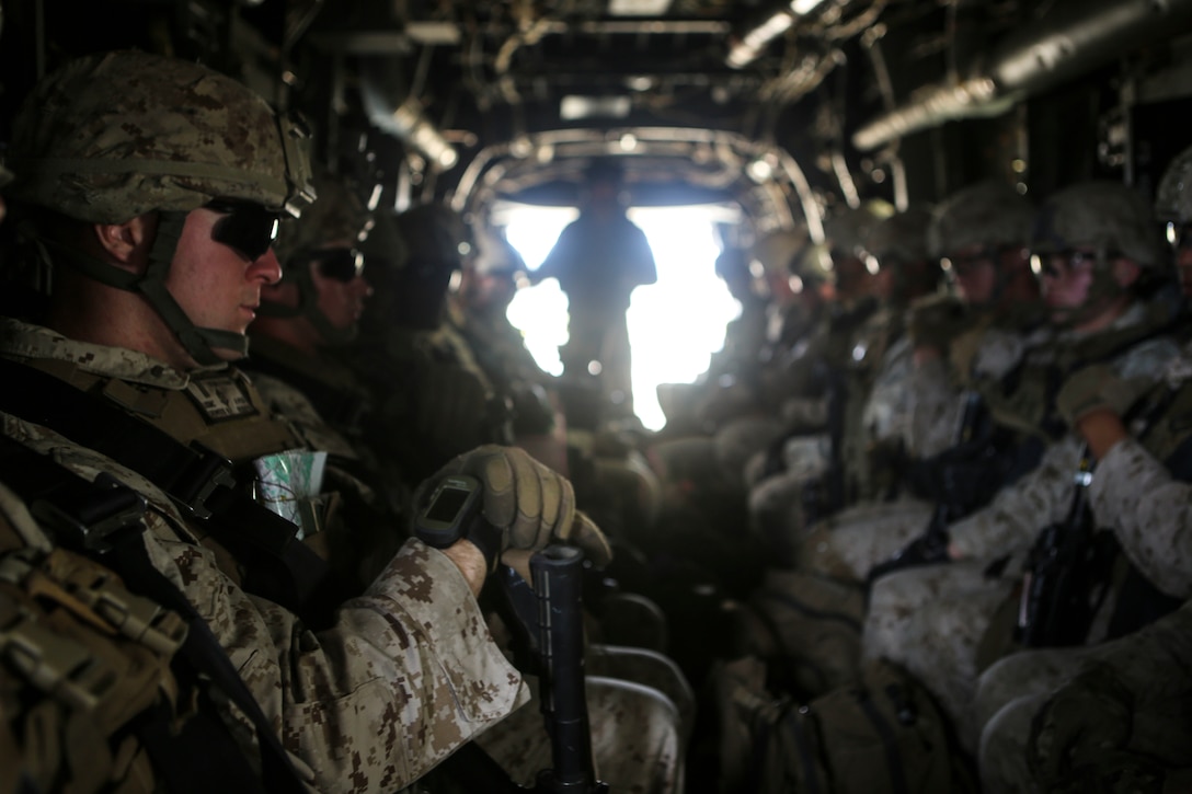Marines with the 11th Marine Expeditionary Unit fly to their objective in an MV-22B Osprey with Marine Medium Tiltrotor Squadron (VMM) 163 (Reinforced) on Marine Corps Base Camp Pendleton, Calif., May 17. Marines with VMM-163 (Rein.) supplied four MV-22B Ospreys, two AH-1W Cobras, two UH-1Y Hueys and one CH-53E Super Stallion to support a simulated raid. (U.S. Marine Corps photo by Lance Cpl. Harley Robinson/Released)