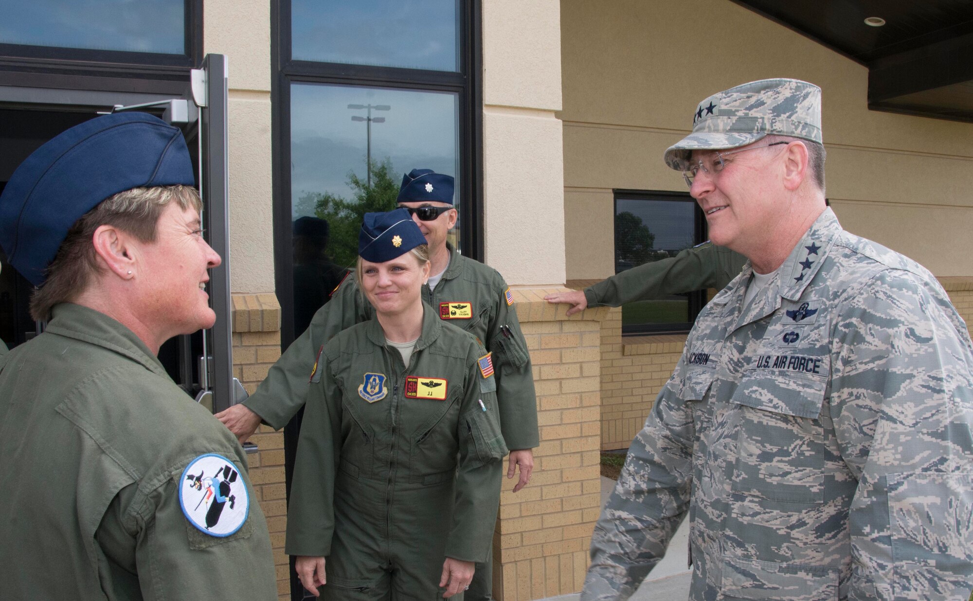 Senior Master Sgt. Kelly Witt, of the 730th Air Mobility Training Squadron at Altus Air Force Base, Okla., and Maj. Jenette “JJ” Milburn, 465th Air Refueling Squadron pilot, greet Lt. Gen. James “JJ” Jackson, Chief of Air Force Reserve and Commander, Air Force Reserve Command, May 14, 2016, at Tinker Air Force Base, Oklahoma. (U.S. Air Force Photo/Tech. Sgt. Lauren Gleason)