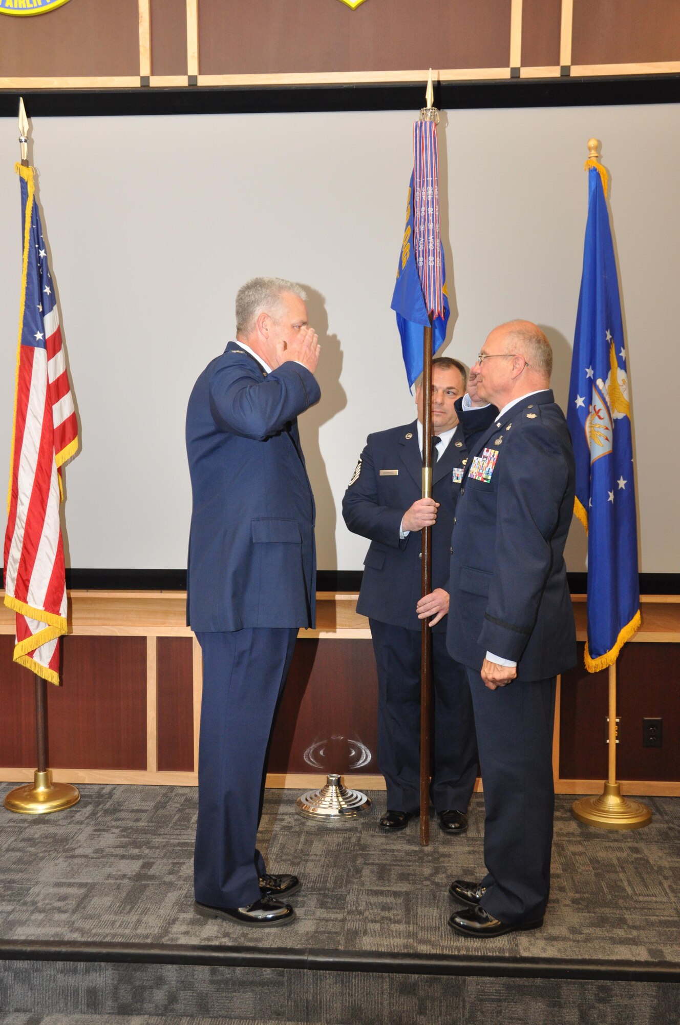 Lt. Col. Mike Hilyard salutes Col. Donald Richey, 908th Operations Group Commander, signifying his readiness to assume command of the 908th Aeromedical Evacuation Squadron. (U.S. Air Force photo by Andrew Stamer)
