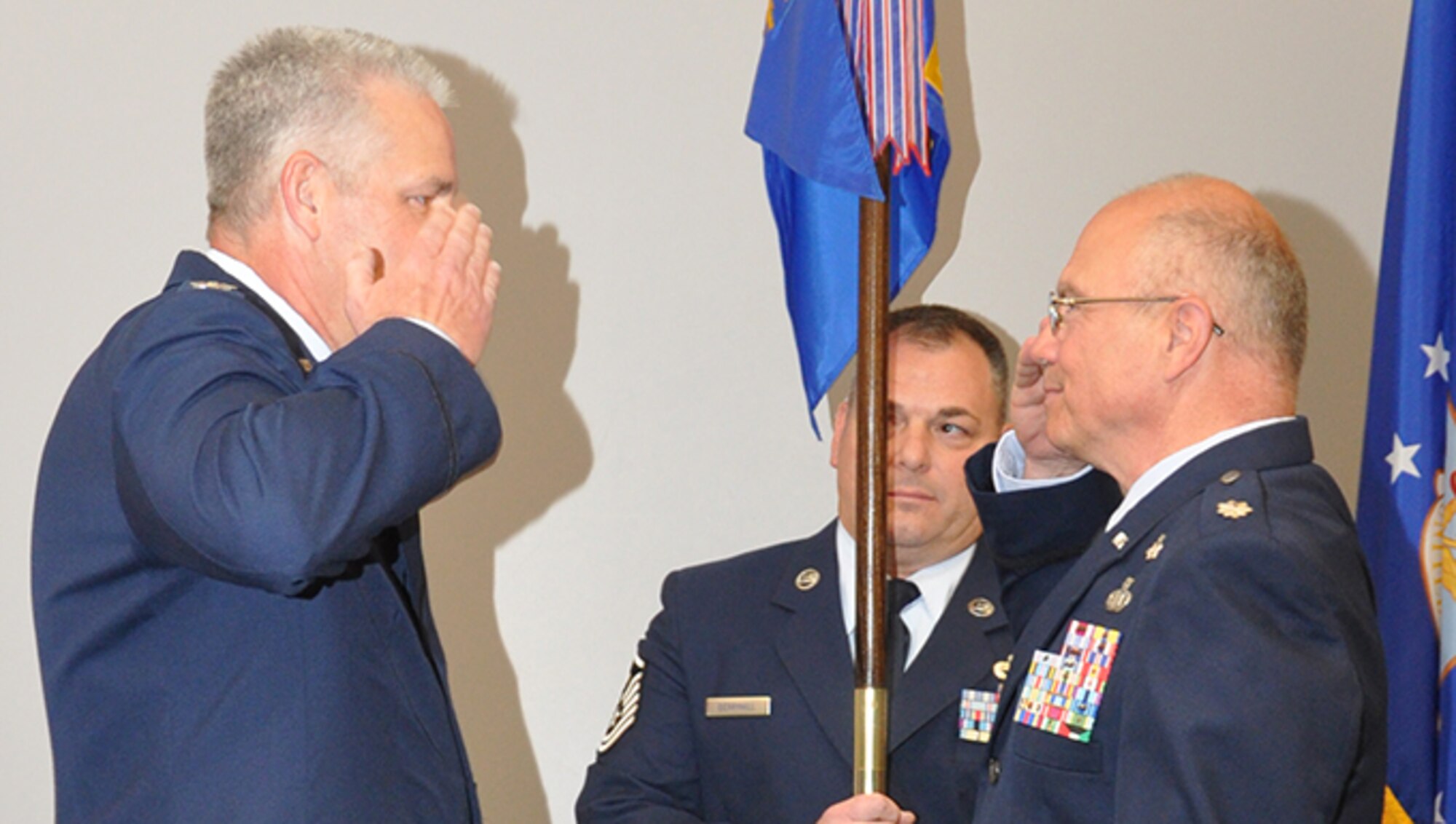 Lt. Col. Mike Hilyard salutes Col. Donald Richey, 908th Operations Group Commander, signifying his readiness to assume command of the 908th Aeromedical Evacuation Squadron. (U.S. Air Force photo by Andrew Stamer)