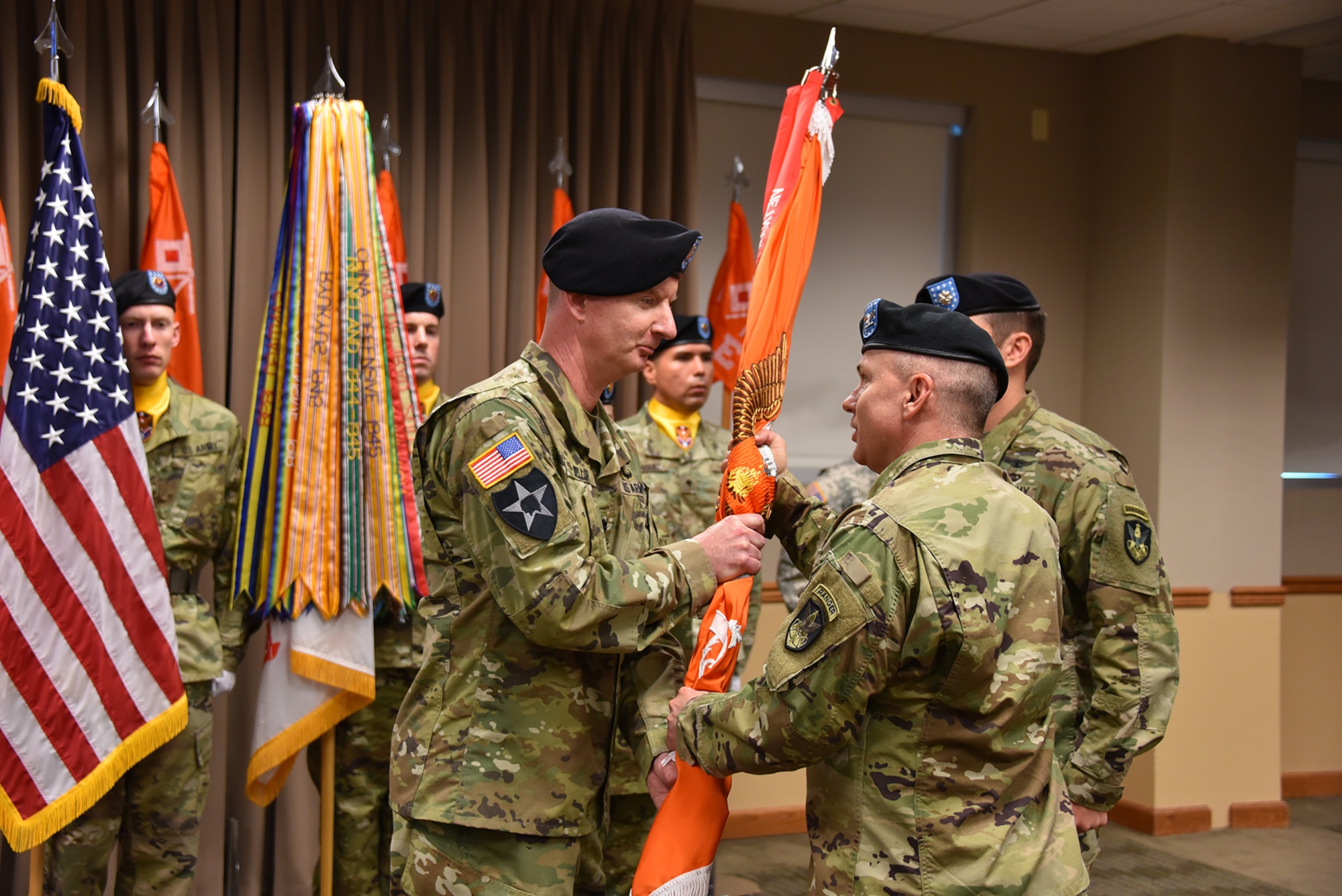 Incoming 53rd Signal Battalion Commander Lt. Col. Glenn O. Mellor (left) receives the 53rd Signal Battalion colors from 1st Space Brigade Commander Col. Thomas L. James May 20, 2016, during a change of command ceremony at the Peterson Air Force Base headquarters.(Photo by Dottie White)
