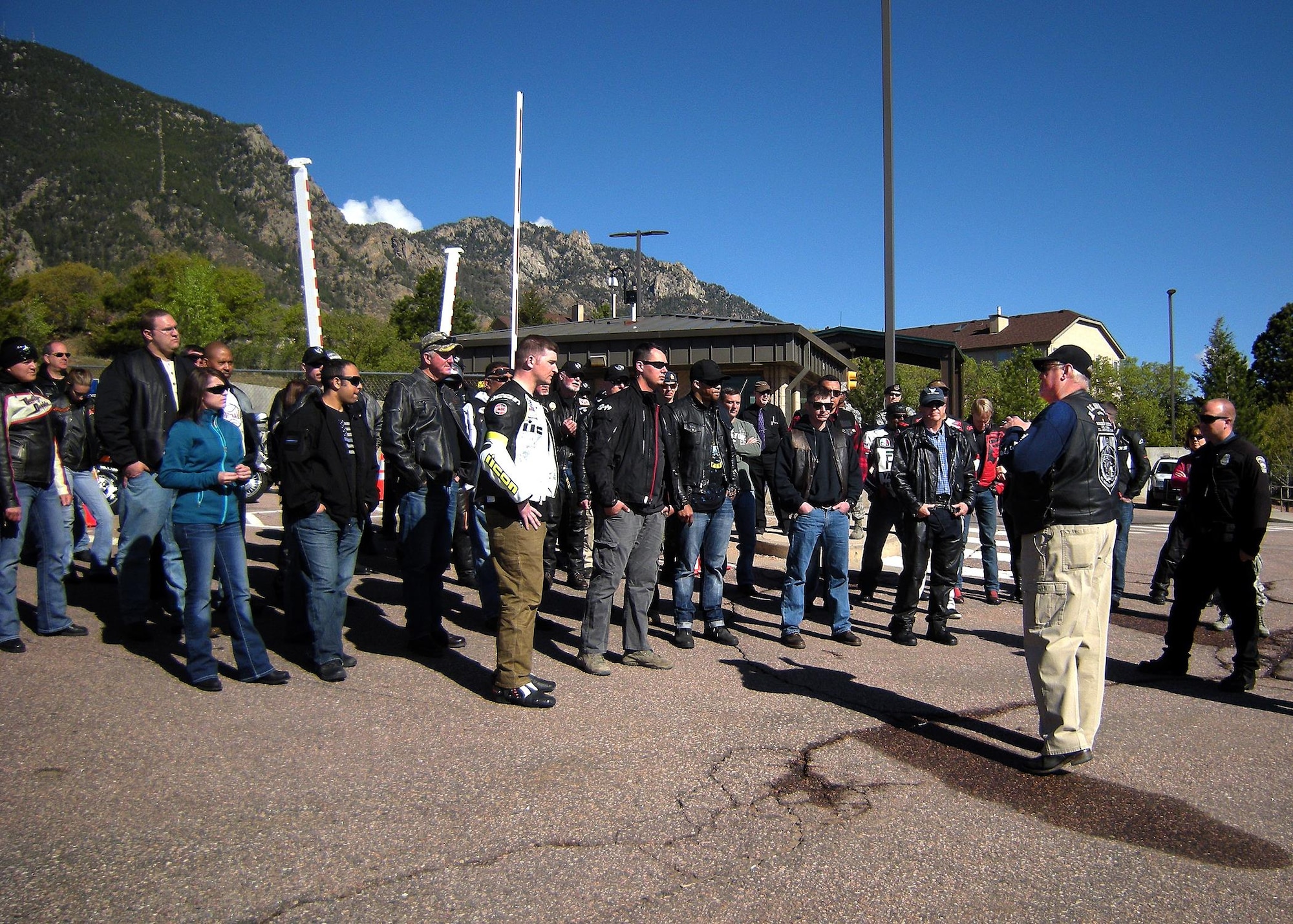 Scott Deeds, 721st Security Forces Squadron, provides a rider briefing prior to the National Police Week Pikes Peak Fallen Officers Ride here on May 19, 2016. Hosted by the 721st SFS, this is the third year Mr. Deeds has organized the annual event in remembrance of all fallen police officers; military and civilian. This fund is used to assist officers who have been catastrophically injured or killed in the line of duty, with 100% of all donations going directly to the assistance of those officers and their families. (U.S. Air Force photo by Rob Bussard)