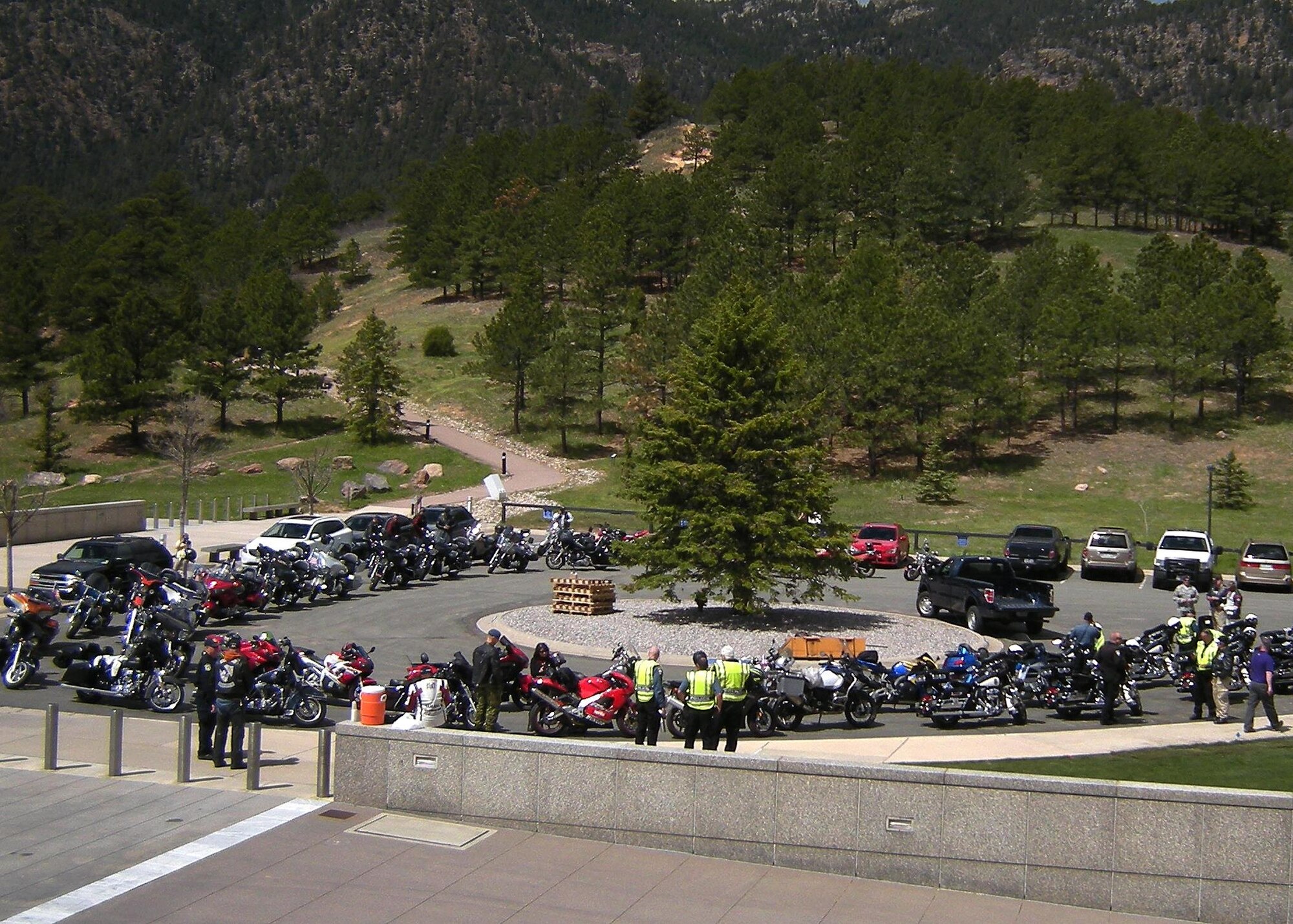 UNITED STATES AIR FORCE ACADEMY, Colo. -- With the Colorado Springs Police Department Motorcycle Unit as their escorts, riders take a break near the chapel during the National Police Week Pikes Peak Fallen Officers Ride on May 19, 2016. Sixty-five riders supported the event this year, riding through all five of the Colorado Springs area military bases, raising money for the Colorado Springs Police Protective Association's Fallen Officer fund.  (U.S. Air Force photo by Rob Bussard)