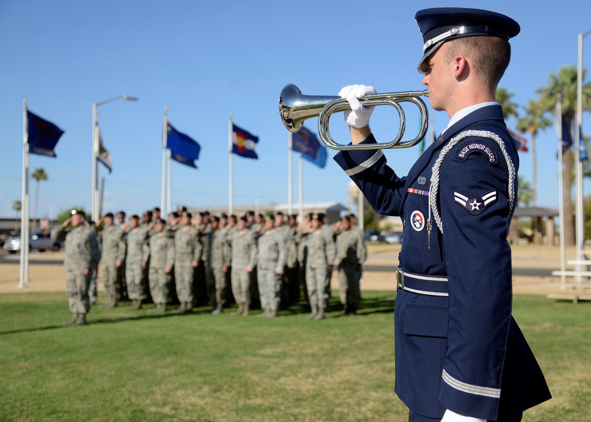 A member of the Luke Air Force Base Honor Guard performs taps during the S.S. Mayaguez Memorial Retreat Ceremony May 19, 2016 at Luke Air Force Base, Ariz. Every year police departments and law enforcement agencies come together to honor and remember those who have served our communities and those who made the ultimate sacrifice. (U.S. Air Force photo by Senior Airman Devante Williams)
