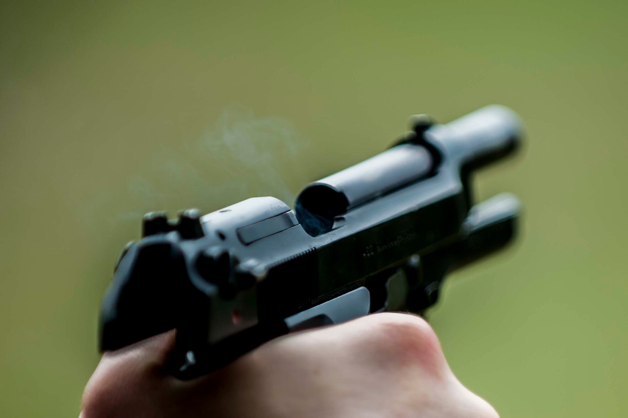 U.S. Air Force Senior Airman Jonathan Rivera, a 213th Security Forces Squadron controller from Clear Air Force Station, Alaska, fires an M9 pistol during a small arms competition at Eielson Air Force Base, Alaska, May 18, 2016, as part of National Police Week activities. The small arms competition was one of the main events for the week, along with equipment displays, a military working dog competition and the Fallen Heroes 5K Run/Ruck. (U.S. Air Force photo by Staff Sgt. Joshua Turner/Released)