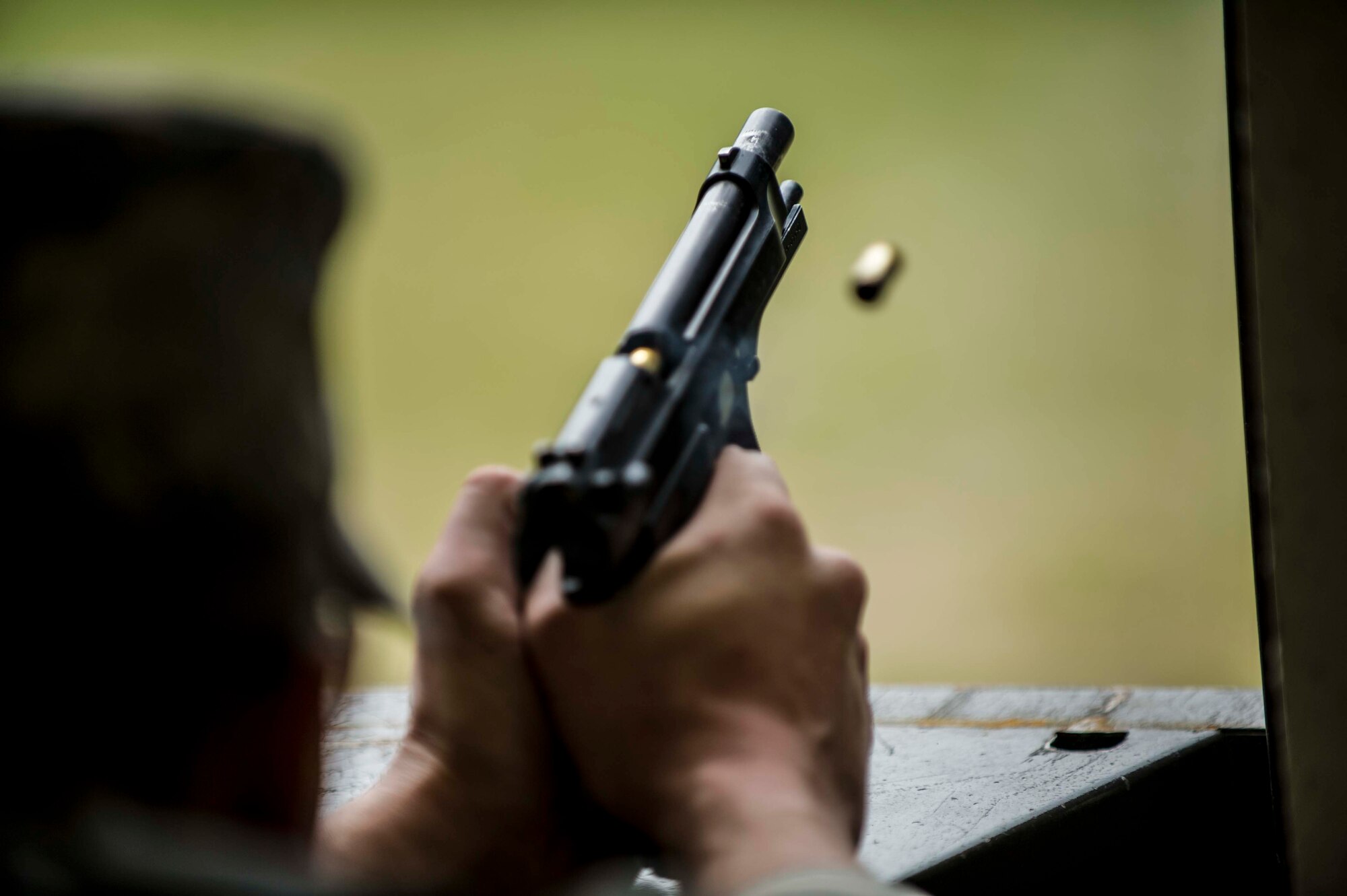 U.S. Air Force Senior Airman Jonathan Rivera, a 213th Security Forces Squadron controller from Clear Air Force Station, Alaska, fires an M9 pistol during a small arms competition at Eielson Air Force Base, Alaska, May 18, 2016, as part of National Police Week activities. Police Week is a time set aside to remember those who have fallen defending others and learn about how law enforcement and security forces members contribute to public safety on a daily basis. (U.S. Air Force photo by Staff Sgt. Joshua Turner/Released)