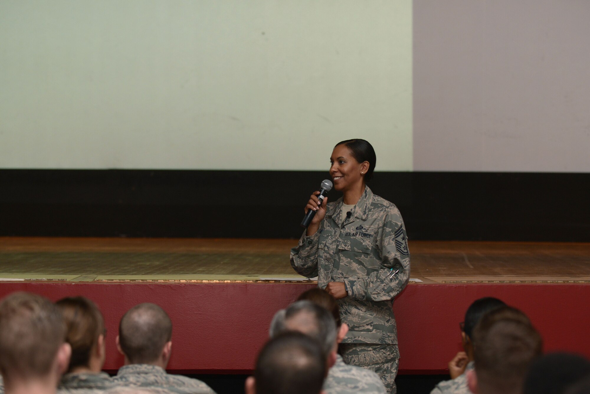 Chief Master Sgt. Sonia Lee, 28th Bomb Wing command chief, speaks to Ellsworth Airmen during an enlisted all call in the base theatre at Ellsworth Air Force Base, S.D., May 10, 2016. Lee spoke on evaluations, diversity and promotions, as well as emphasizing the importance of professionalism. (U.S. Air Force photo by Airman Donald Knechtel/Released)