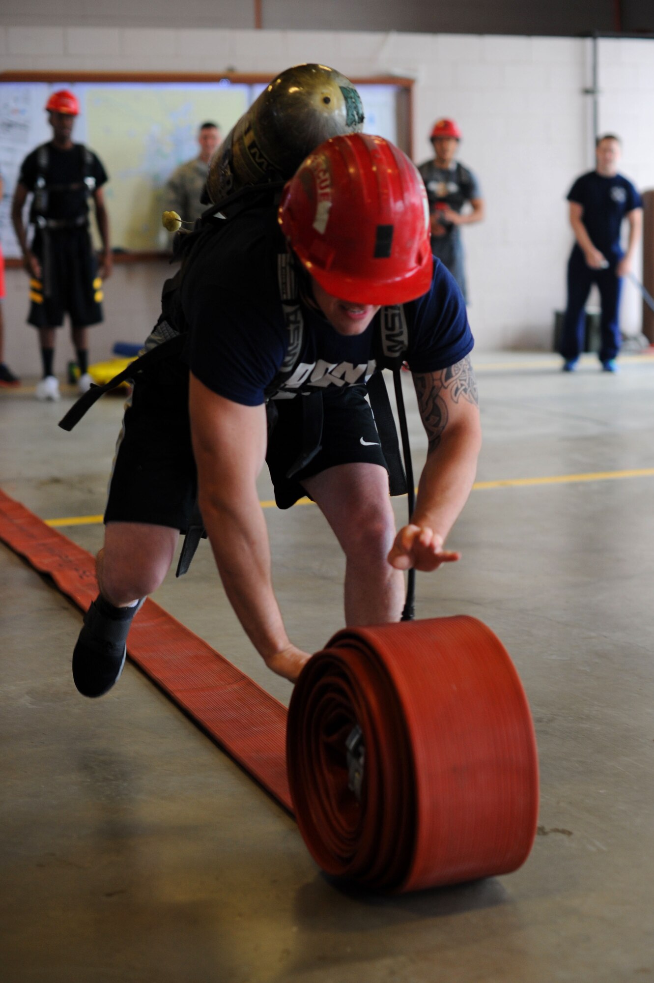 The 22nd Security Forces Squadron defenders and the 22nd Civil Engineer Squadron firefighters went head-to-head during the Battle of the Badges, May 19, 2016, at McConnell Air Force Base, Kan. Over the course of the day, the two groups competed in weightlifting, dodgeball, a fit challenge, basketball and flag football. (U.S. Air Force photos by Airman 1st Class Jenna K. Caldwell)