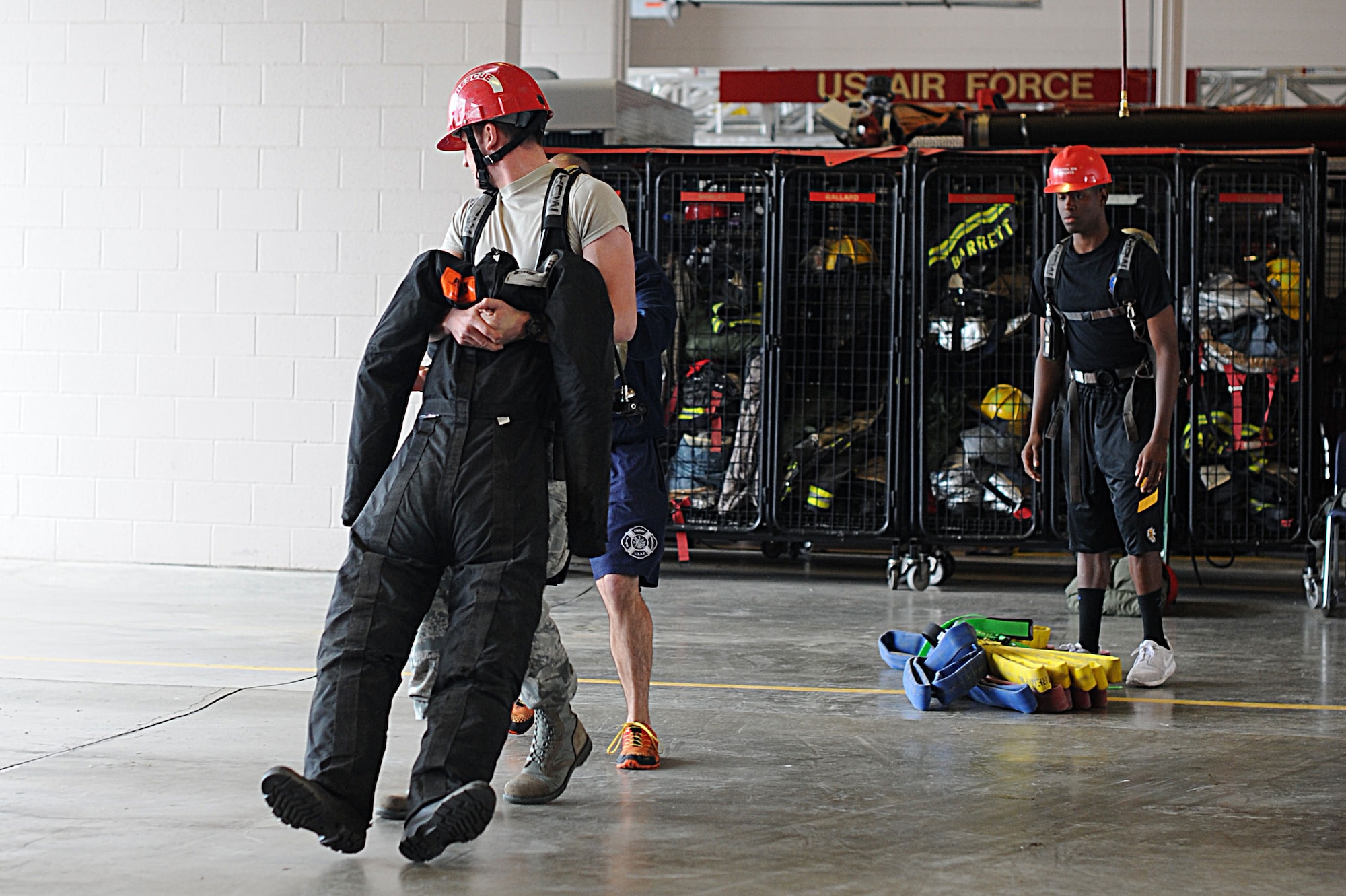 The 22nd Security Forces Squadron defenders and the 22nd Civil Engineer Squadron firefighters went head-to-head during the Battle of the Badges, May 19, 2016, at McConnell Air Force Base, Kan. Over the course of the day, the two groups competed in weightlifting, dodgeball, a fit challenge, basketball and flag football. (U.S. Air Force photos by Airman 1st Class Jenna K. Caldwell)