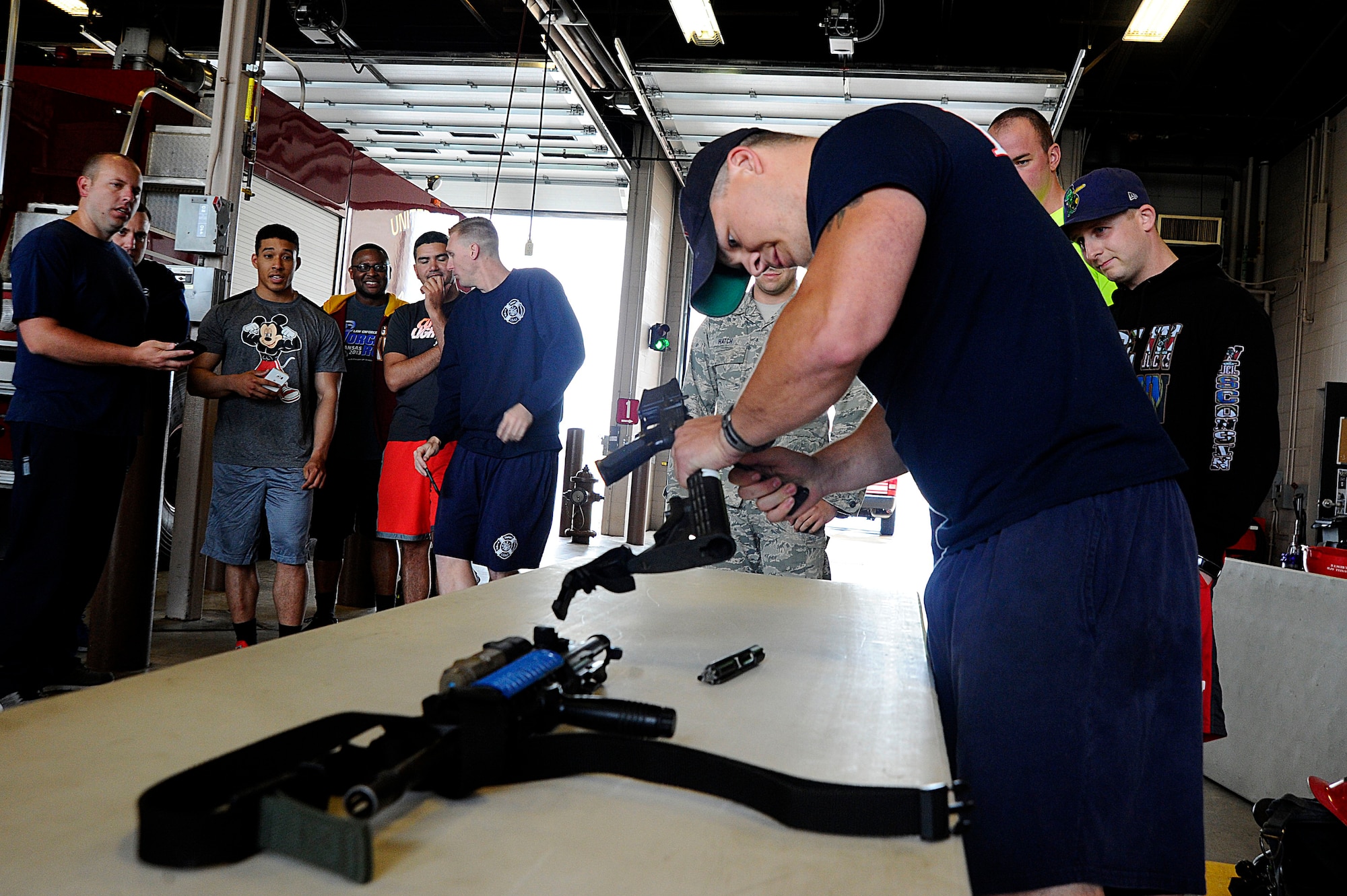 The 22nd Security Forces Squadron defenders and the 22nd Civil Engineer Squadron firefighters went head-to-head during the Battle of the Badges, May 19, 2016, at McConnell Air Force Base, Kan. Over the course of the day, the two groups competed in weightlifting, dodgeball, a fit challenge, basketball and flag football. (U.S. Air Force photos by Airman 1st Class Jenna K. Caldwell)