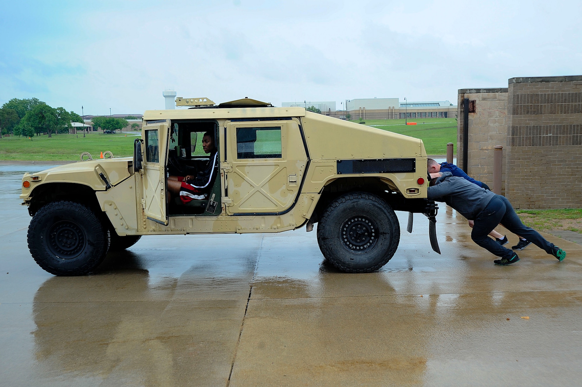 The 22nd Security Forces Squadron defenders and the 22nd Civil Engineer Squadron firefighters went head-to-head during the Battle of the Badges, May 19, 2016, at McConnell Air Force Base, Kan. Over the course of the day, the two groups competed in weightlifting, dodgeball, a fit challenge, basketball and flag football. (U.S. Air Force photos by Airman 1st Class Jenna K. Caldwell)